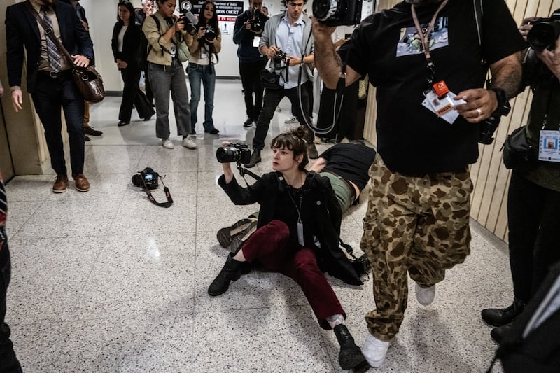 NEW YORK, NEW YORK - SEPTEMBER 30: Olga Fedorova, freelance photojournalist, and L. Vural Elibol, a Chief Cameraman and Videographer for the Anadolu Agency, are thrown to the ground by federal agents at the Jacob K. Javits federal courthouse on September 30, 2025 in New York City. Federal agents were detaining an immigrant in the elevator when the altercation began. (Photo by Stephanie Keith/Getty Images)