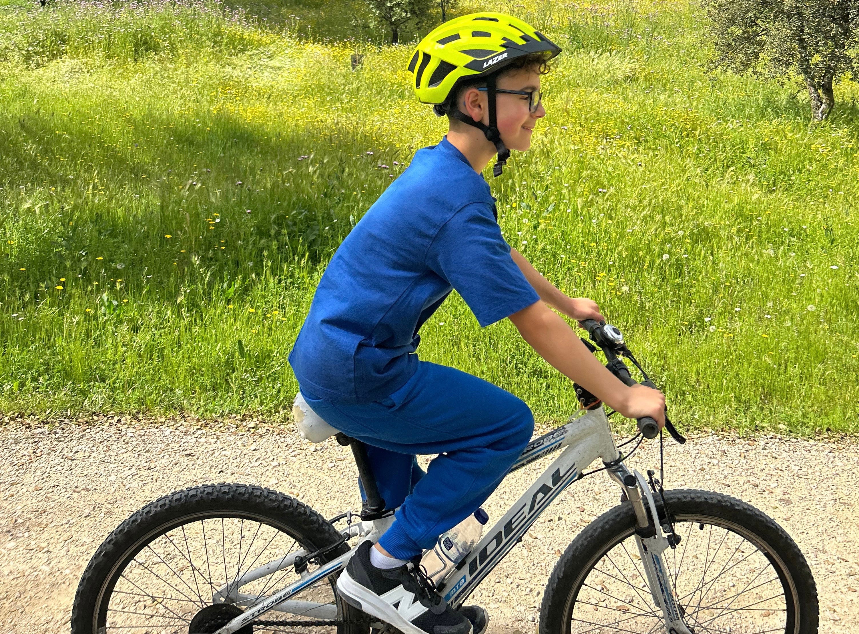 The author's son biking through a park in Madrid.