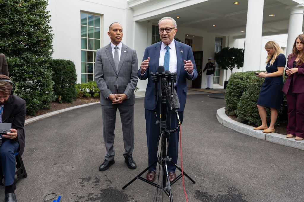 Senate Minority Leader Chuck Schumer speaking at a press conference alongside House Minority Leader Hakeem Jeffries outside the White House.