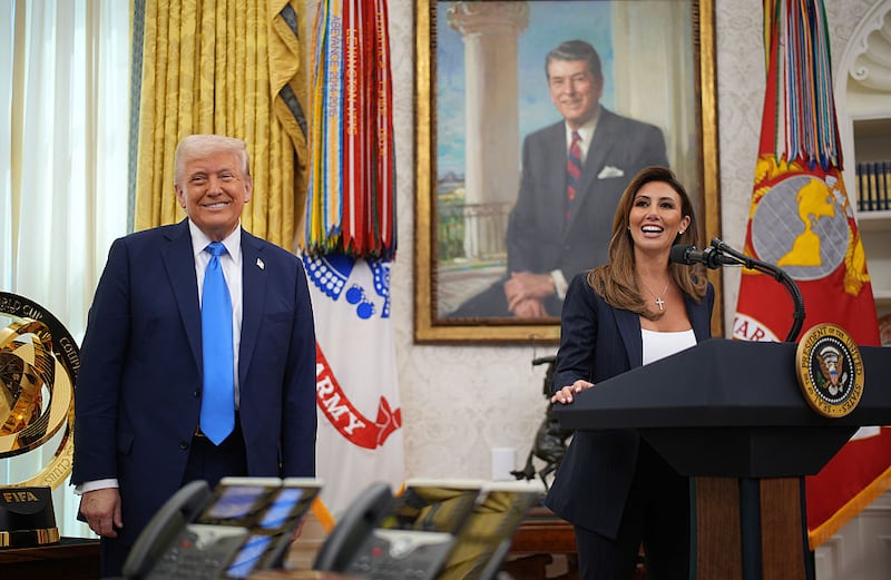 President Donald Trump (L) listens as White House Presidential Counselor Alina Habba delivers remarks before being sworn in as the interim U.S. Attorney for New Jersey in the Oval Office at the White House on March 28, 2025 in Washington, DC. Habba is a former personal attorney for President Donald Trump. (Photo by Andrew Harnik/Getty Images)