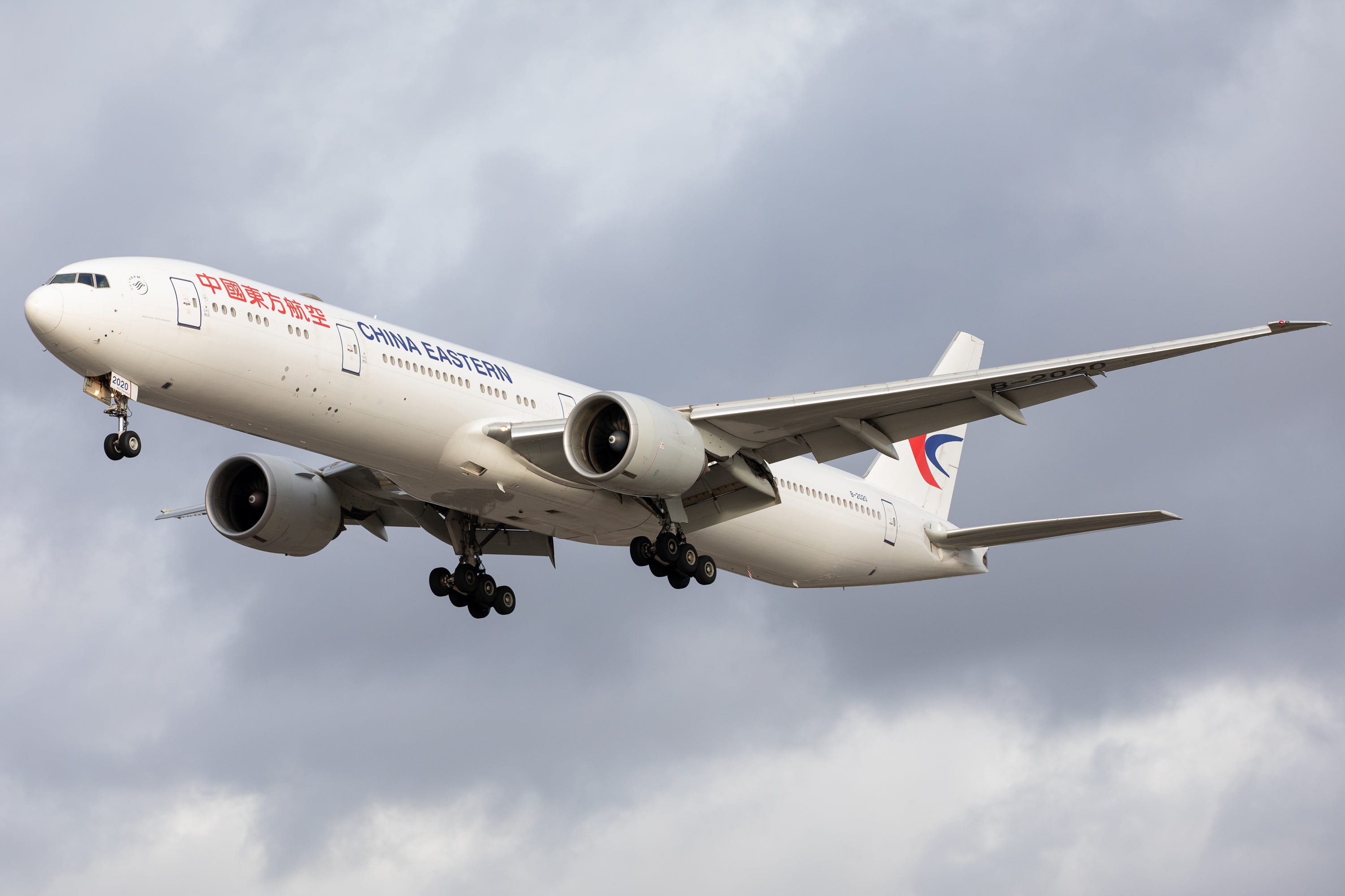 A China Eastern Airlines Boeing 777-300 lands at London Heathrow Airport on 28th October 2020