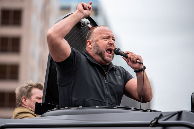 Infowars host Alex Jones arrives at the Texas State Capital building on April 18, 2020 in Austin, Texas. The protest was organized by Infowars host Owen Shroyer who is joining other protesters across the country in taking to the streets to call for the country to be opened up despite the risk of the COVID-19. (Photo by Sergio Flores/Getty Images)