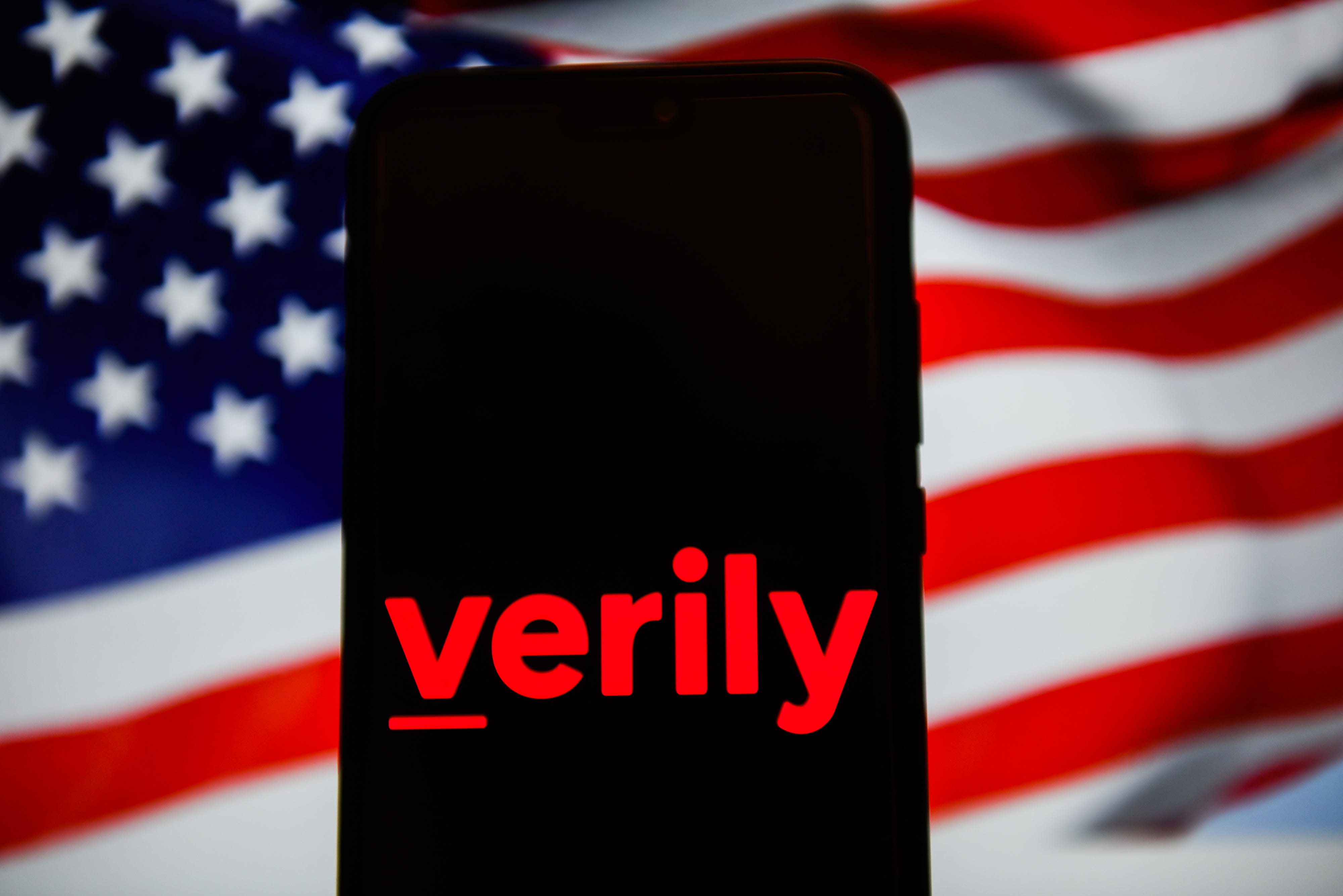 The Verily logo on a phone