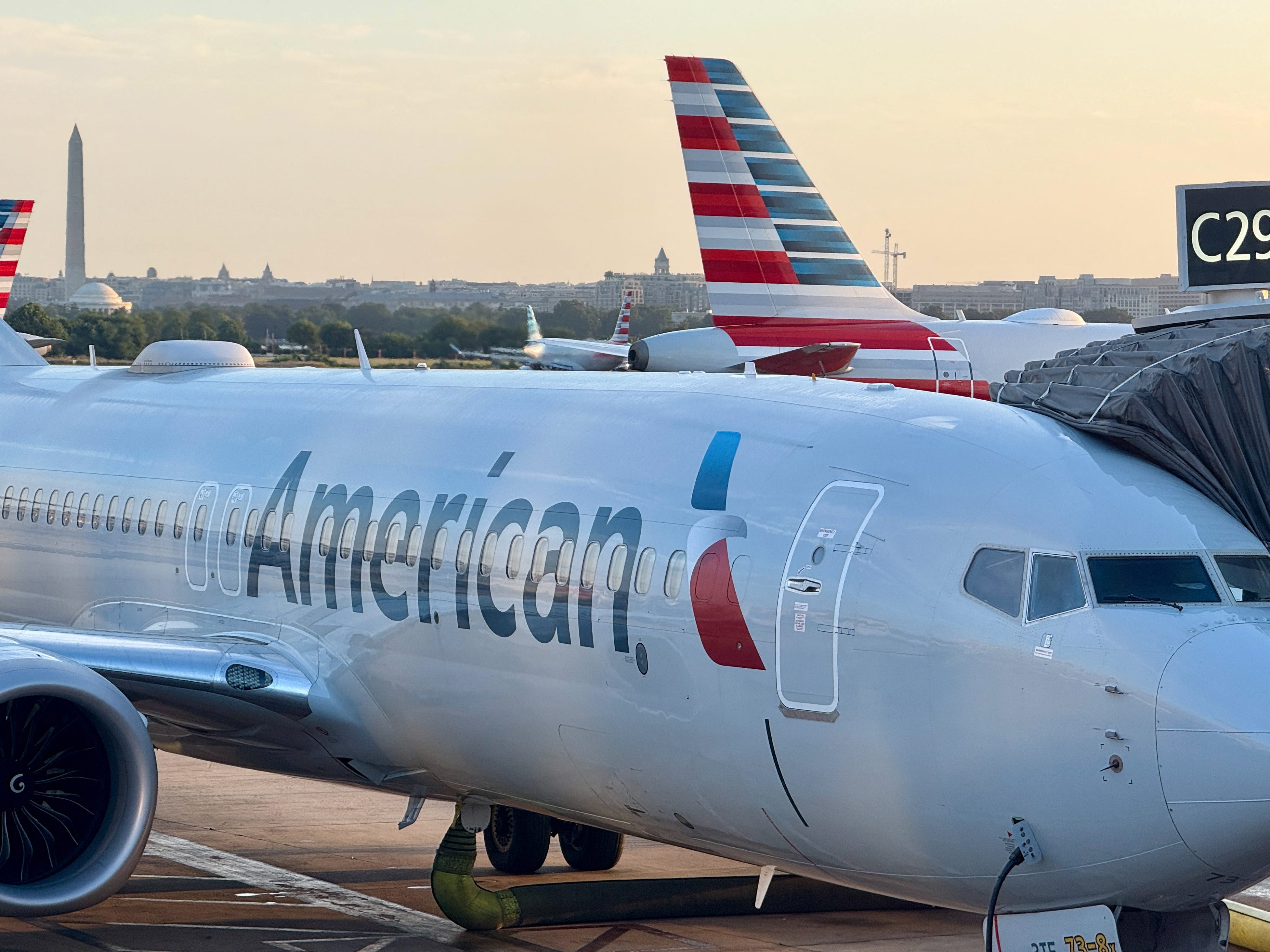 An American Airlines passenger plane is parked at a gate at Ronald Reagan Washington National Airport on August 24, 2025, in Arlington, Virginia.