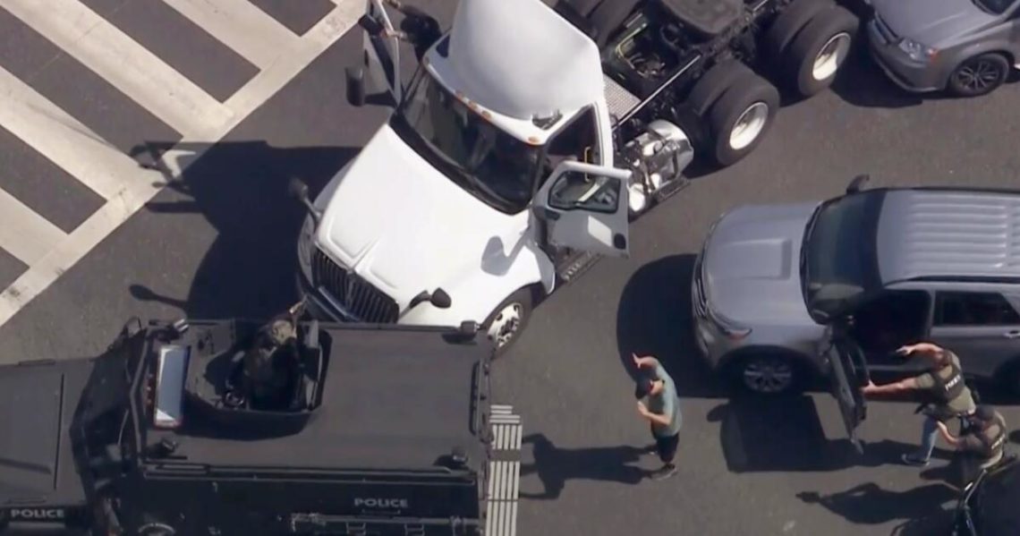 Armored vehicle rams big rig in dramatic police pursuit of suspected stolen vehicle