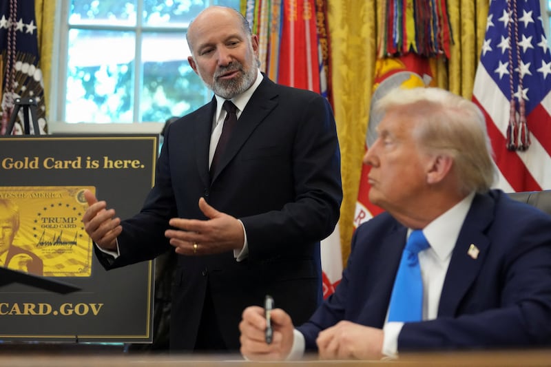 Commerce Secretary Howard Lutnick was standing next to President Donald Trump when he incorrectly stated on Friday that a new fee for H-1B visas would be required annually.