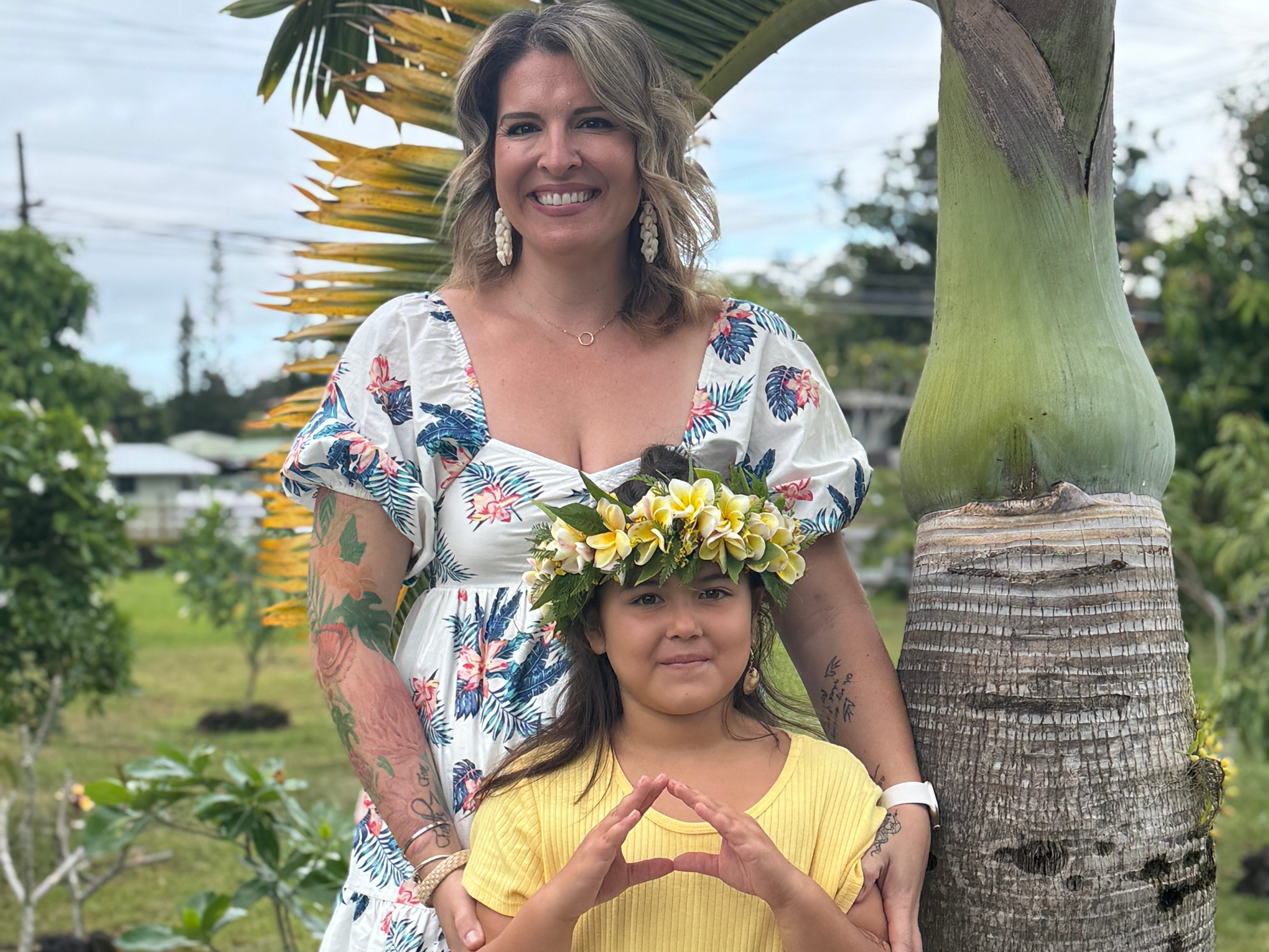 Mom and daughter posing for photo