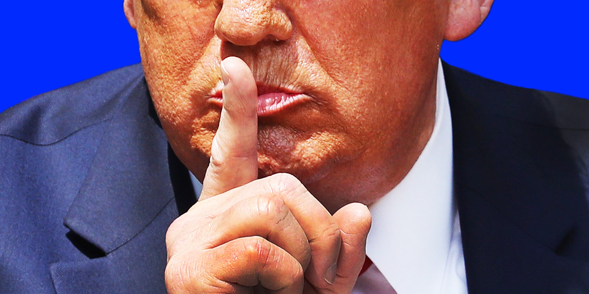 Close up photo of President Donald Trump making a shushing gesture.