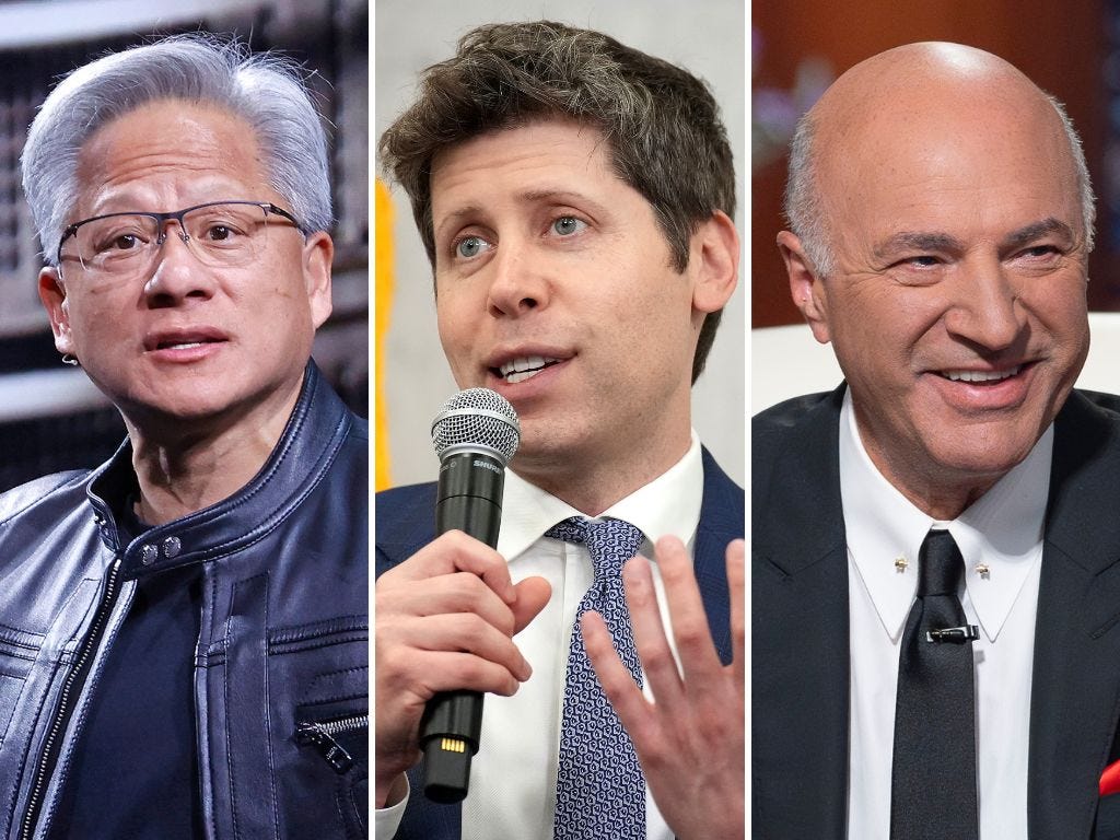 Jensen Huang is wearing a black leather jacket, Sam Altman is holding a microphone and speaking, and Kevin O'Leary is looking toward his left and smiling.