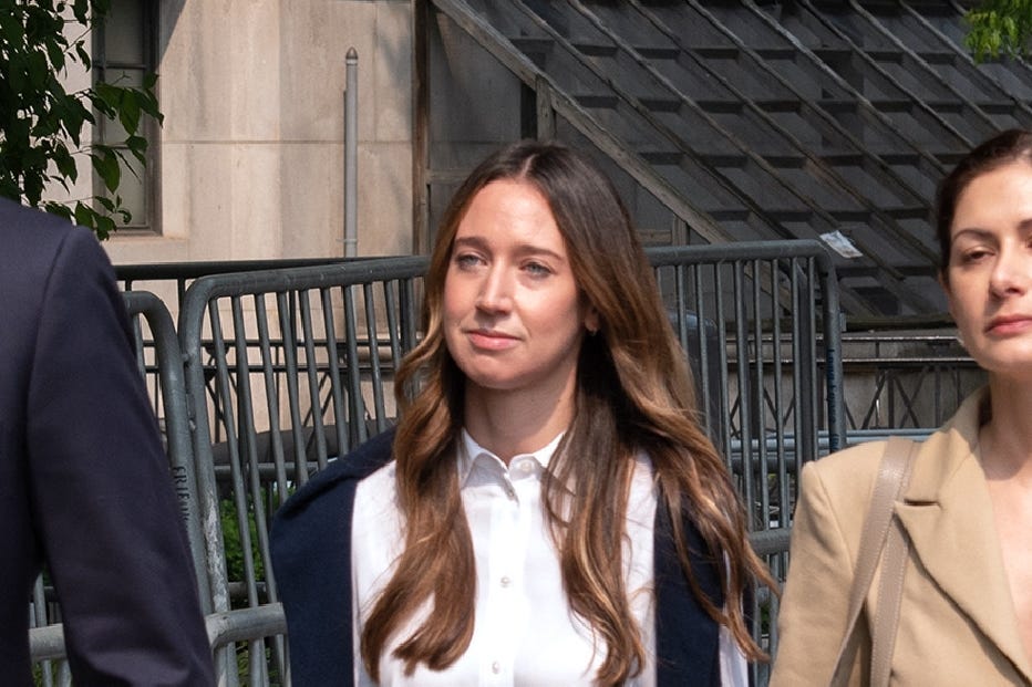 Charlie Javice walks with her legal team into federal court in Manhattan, where she was convicted of defrauding JPMorgan Chase.