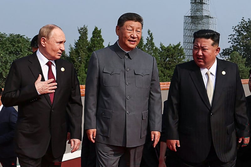 TOPSHOT - In this pool photograph distributed by the Russian state agency Sputnik, (L-R) Russia's President Vladimir Putin walks with China's President Xi Jinping and North Korea's leader Kim Jong Un before a military parade marking the 80th anniversary of victory over Japan and the end of World War II, in Beijing's Tiananmen Square on September 3, 2025. (Photo by Alexander KAZAKOV / POOL / AFP) (Photo by ALEXANDER KAZAKOV/POOL/AFP via Getty Images)
