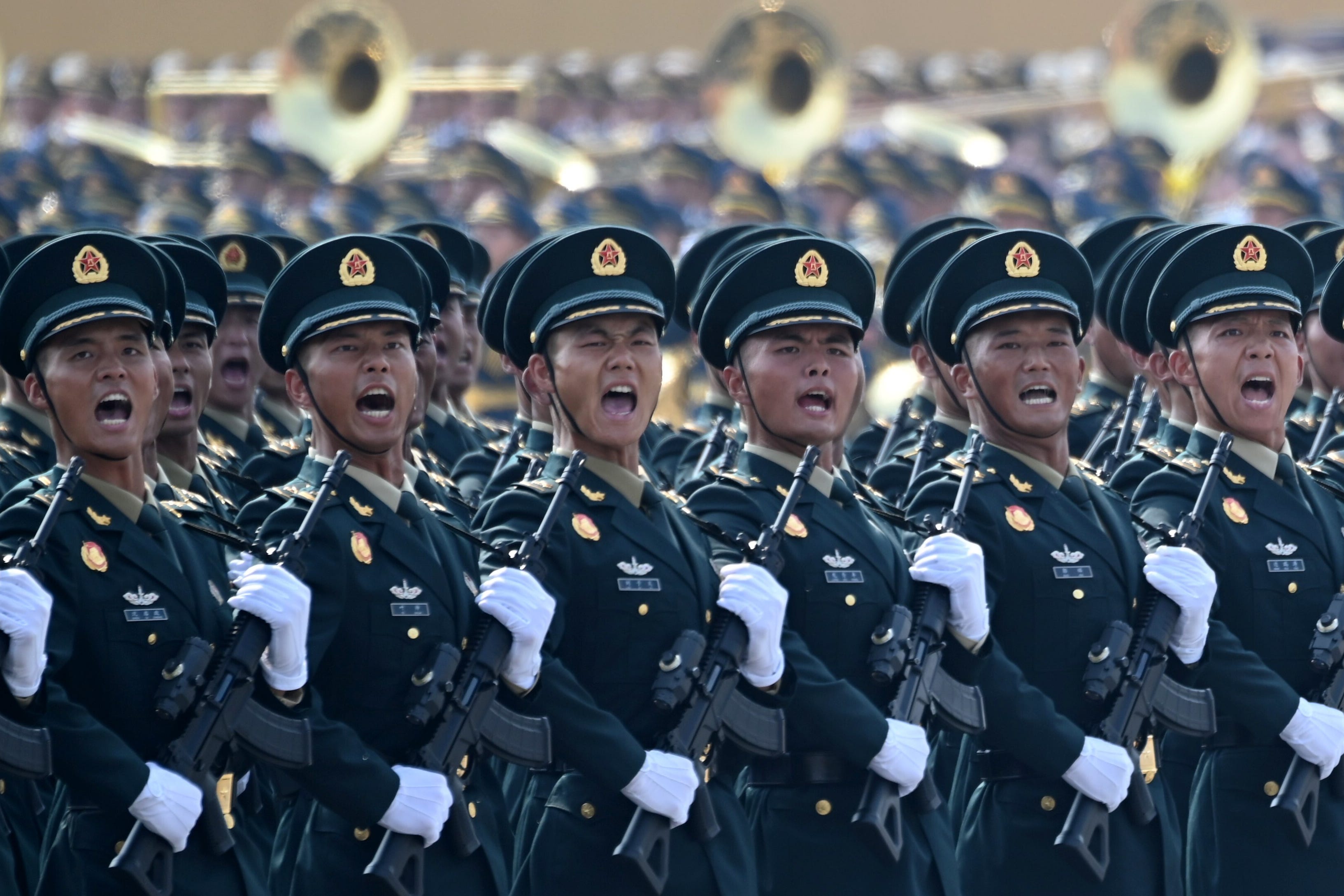 Soldiers shout as they march past Tiananmen Square for the 80th anniversary parade.