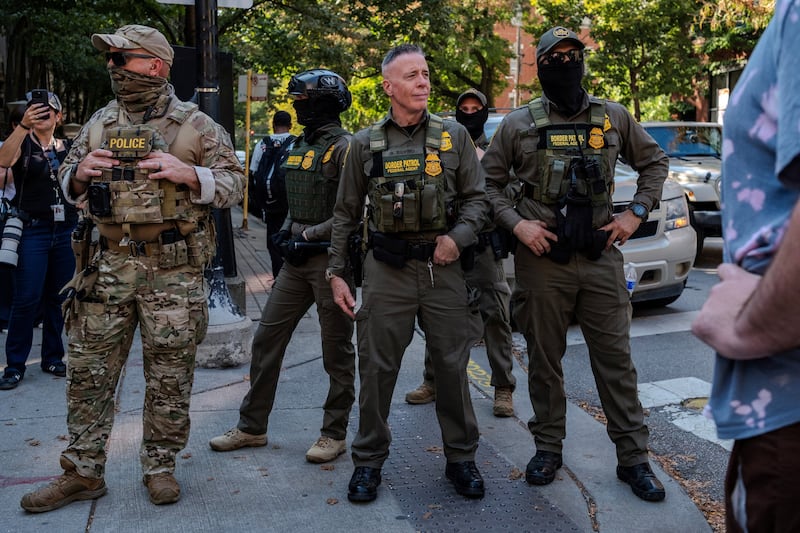 USBP Chief Patrol Agent of the El Centro sector, Greg Bovino, stands on a street corner with federal agents after patrolling several tourist districts in the downtown area, after U.S. President Donald Trump ordered increased federal law enforcement presence to assist in crime prevention, in Chicago, Illinois, U.S. September 28, 2025. REUTERS/Jim Vondruska