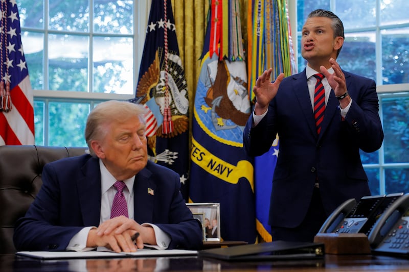 U.S. Defense Secretary Pete Hegseth speaks as U.S. President Donald Trump signs an executive order to rename the Department of Defense the "Department of War", in the Oval Office, at the White House in Washington, D.C., U.S., September 5, 2025. REUTERS/Brian Snyder
