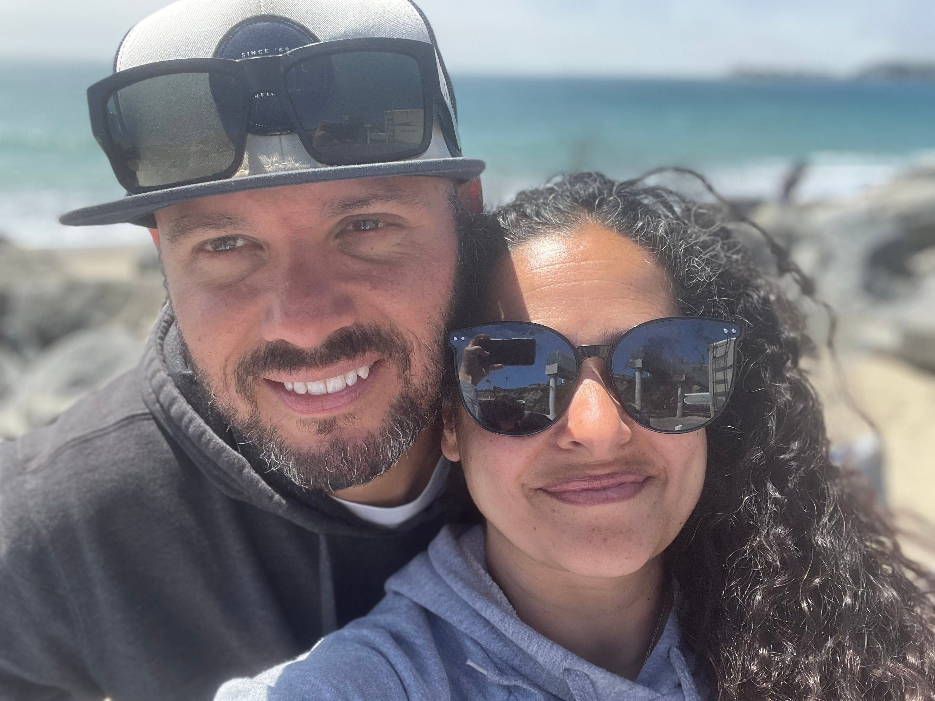 The author and her husband pose on the beach.