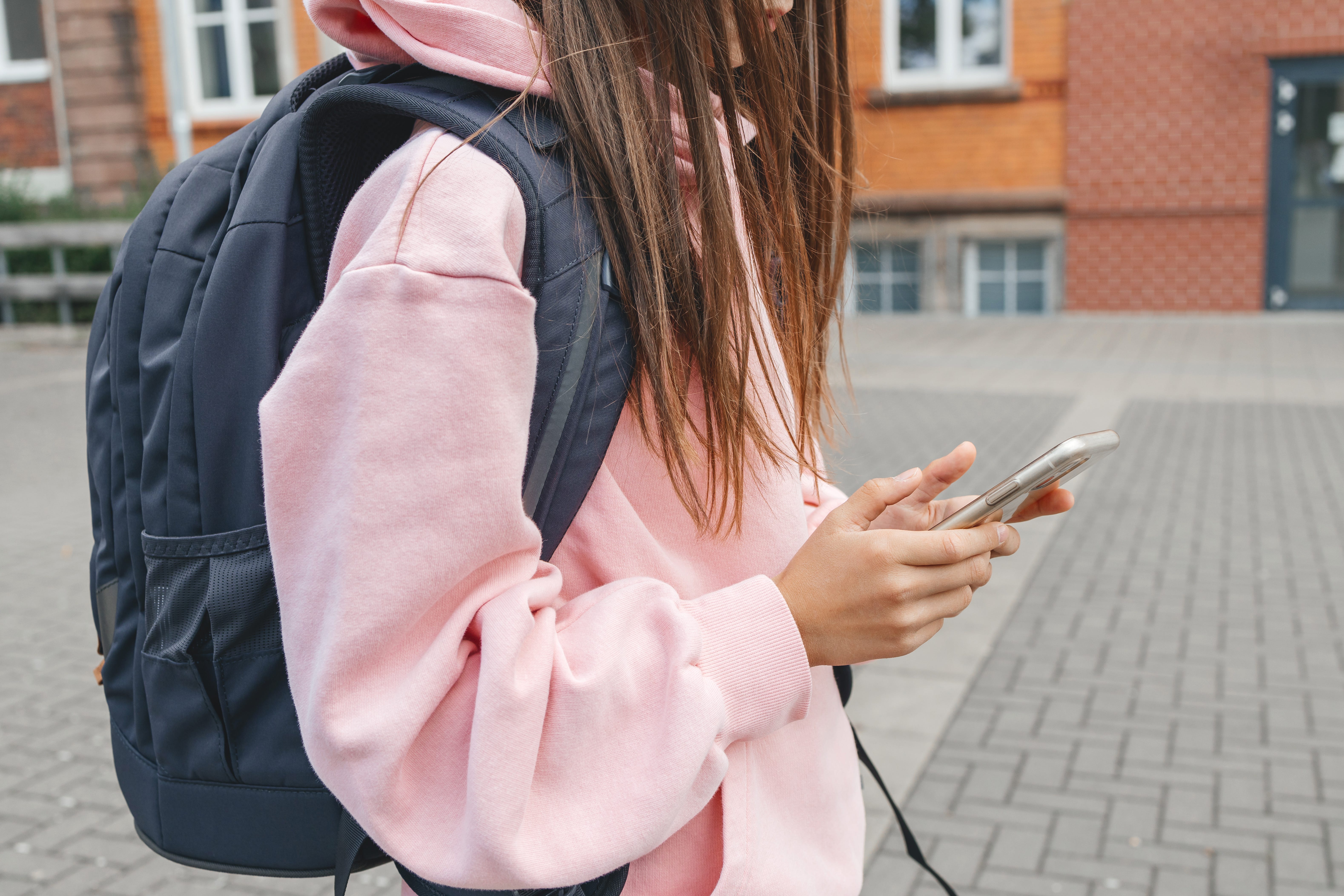 Teenagers chat, communicate online during recess at school