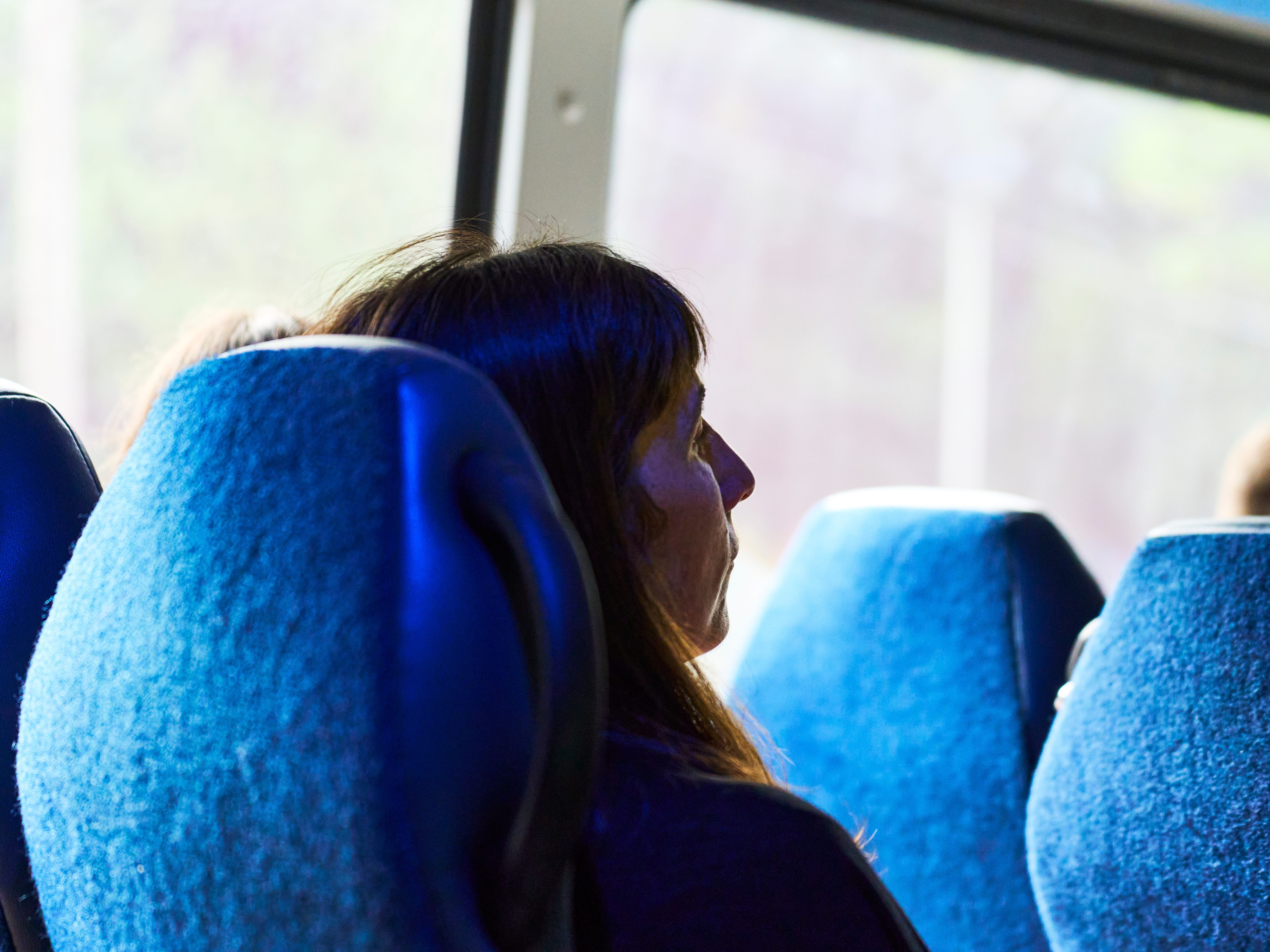 the back of a woman's head on a bus