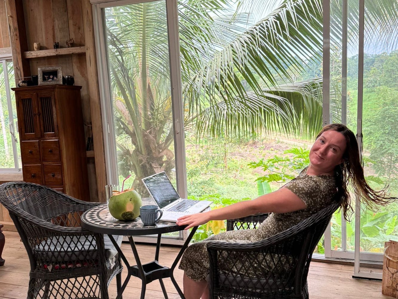 Sinead Mulhern sitting in a wicker chair in a farmhouse in Ecuador.