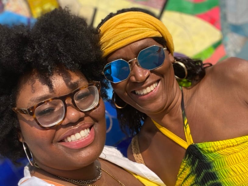 The author and her mom posing together and smiling.