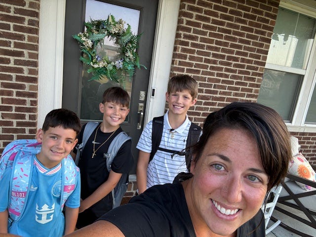 Mom with kids on back to school day