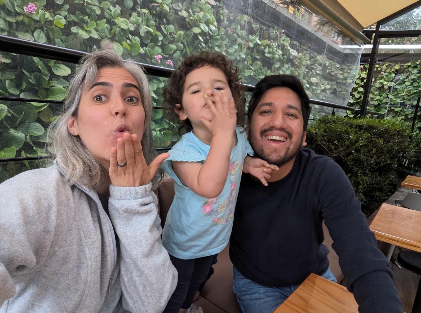 The writer, her husband, and their child in Colombia, where they now live.