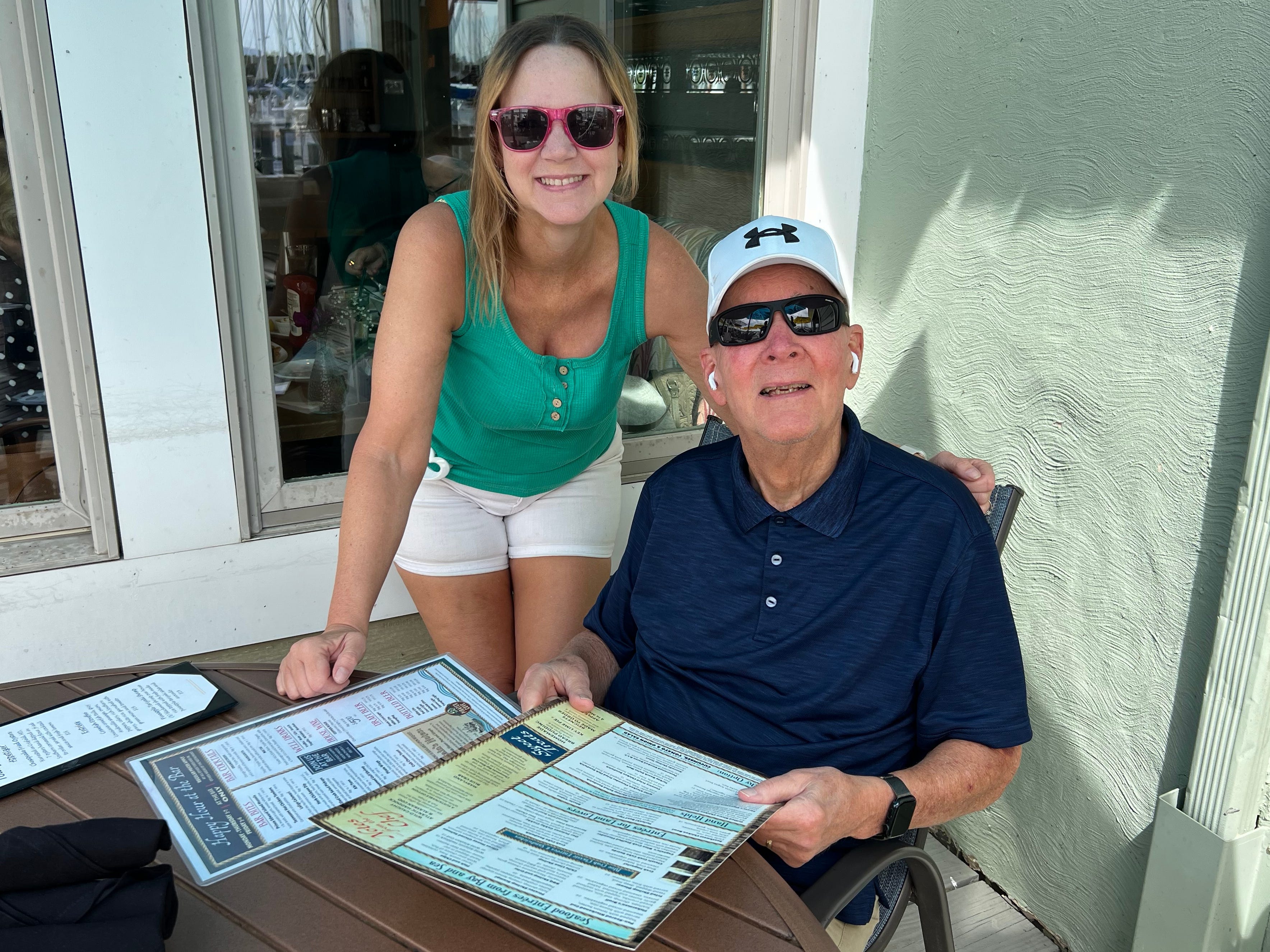 The author poses with her father.
