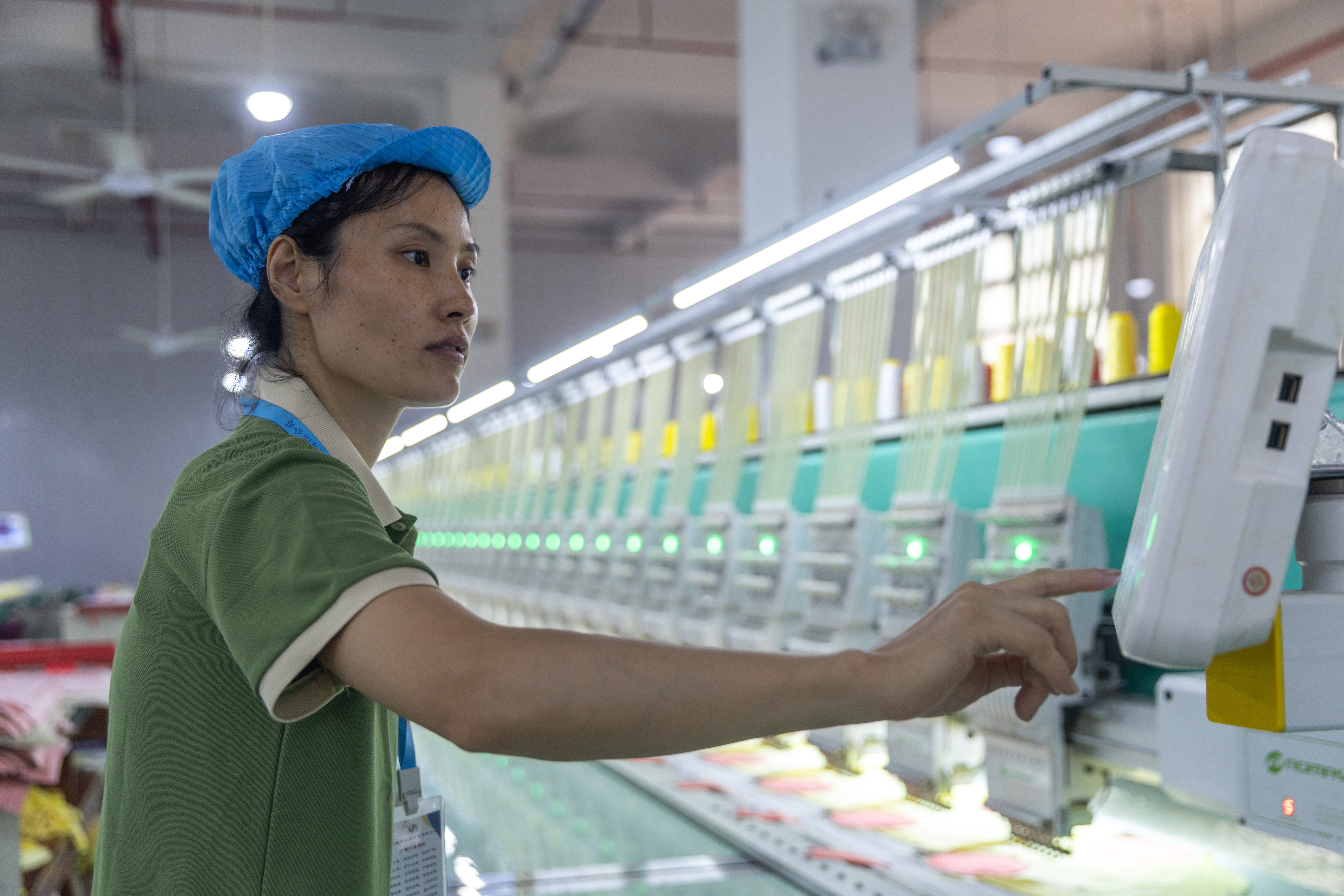 An employee on the automated production line at a toy manufacturer's workshop in Yongzhou, Hunan Province, China, on August 7, 2025.