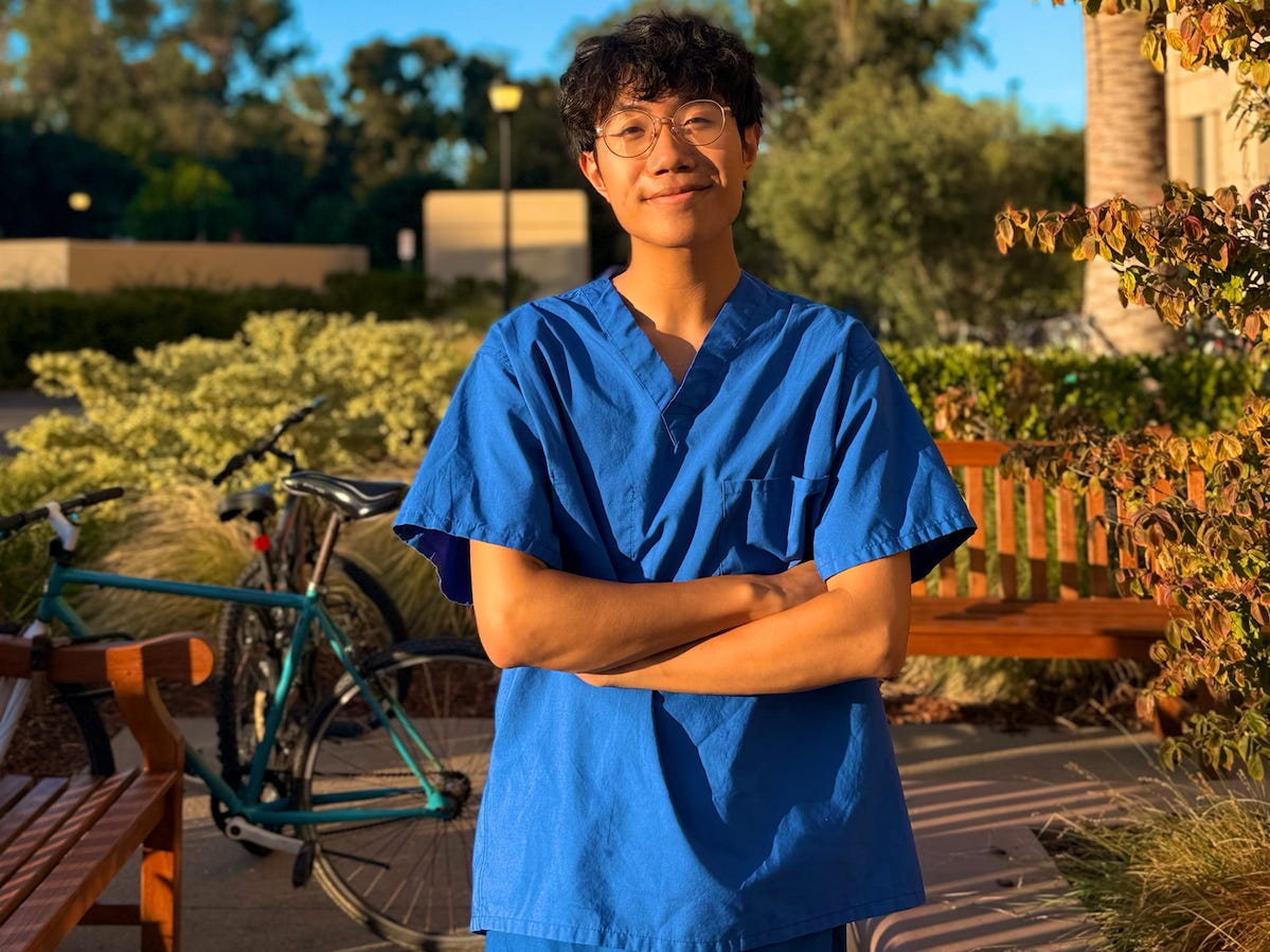Brian Zhang in his scubs on stanford campus