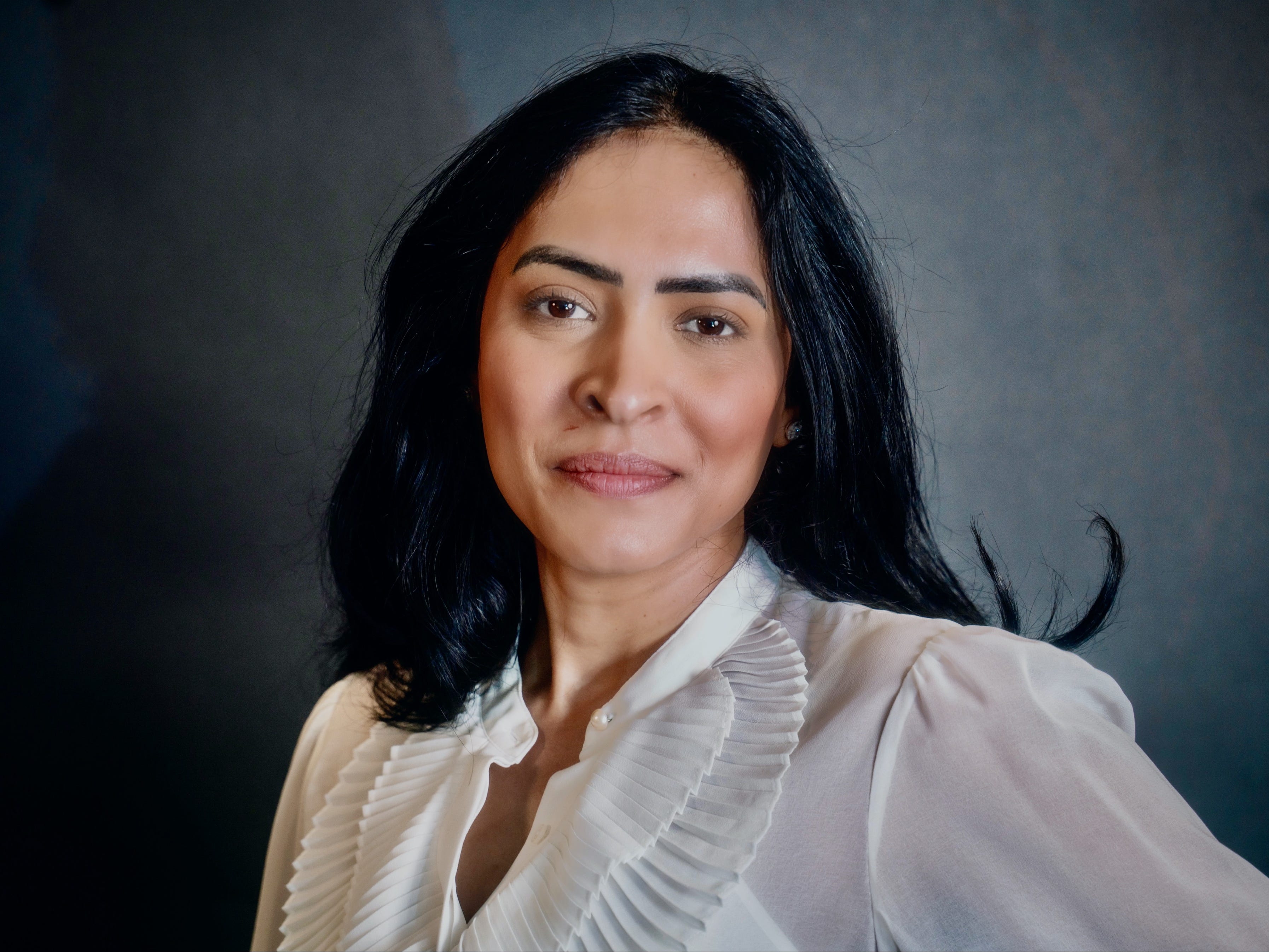 headshot of a woman with black hair