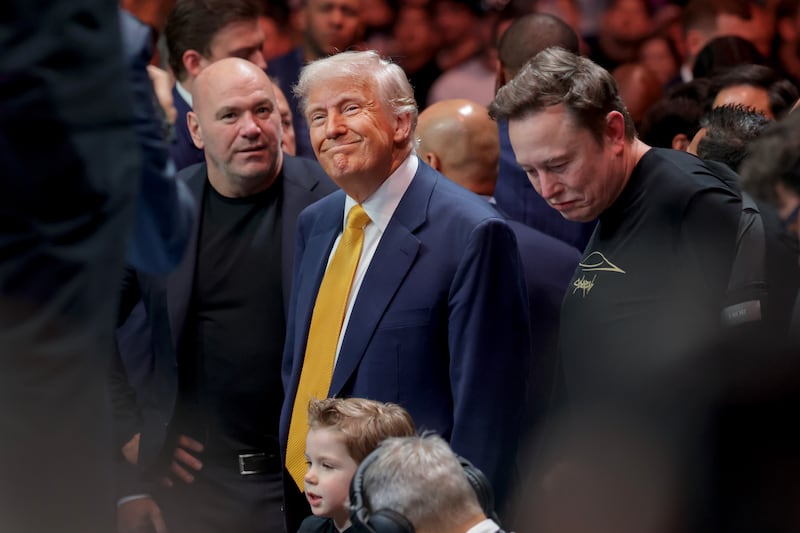 MIAMI, FLORIDA - APRIL 12: U.S. President Donald Trump prepares to watch the Ultimate Fighting Championship (UFC) with UFC CEO Dana White and Elon Musk at the Kaseya Center on April 12, 2025 in Miami, Florida. The Trump administration issued a rule late Friday that spared smartphones, computers, semiconductors, and other electronics from some of the tariffs they have enacted. (Photo by Joe Raedle/Getty Images)