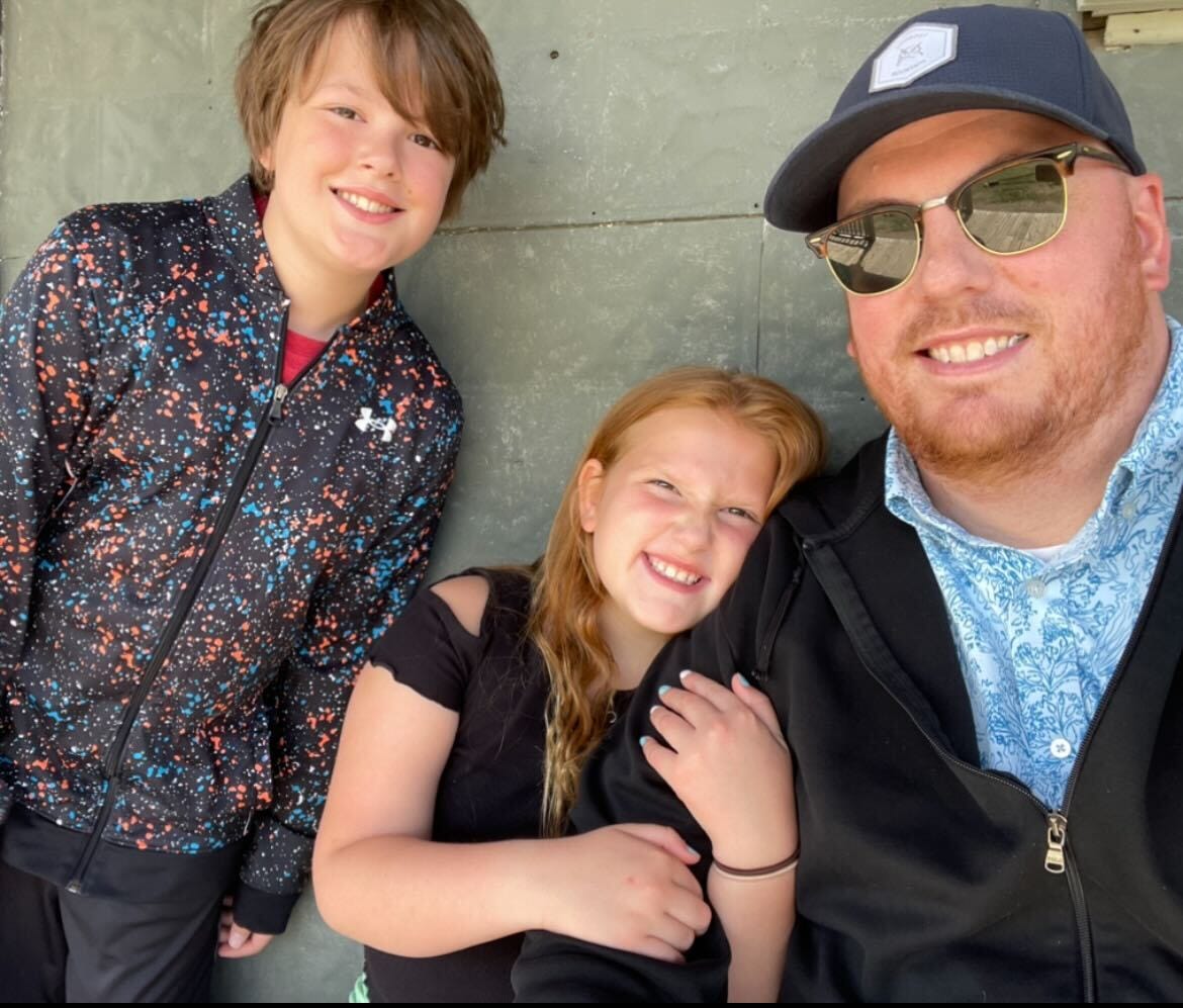 Father, son, and daughter selfie