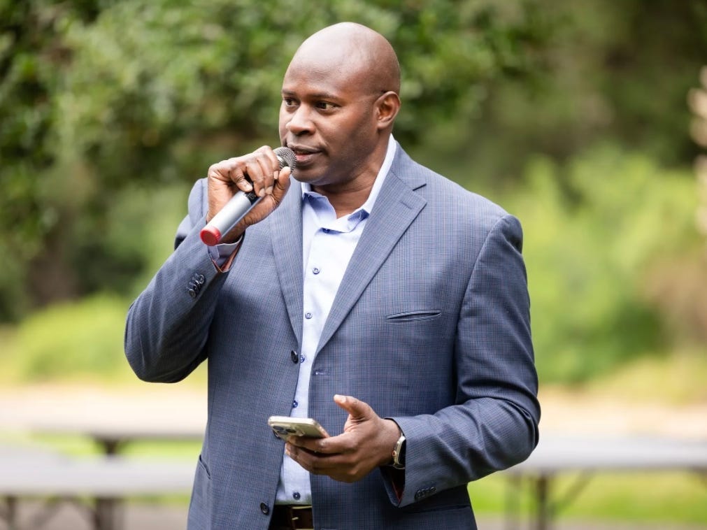Wendell Tull speaking with a mic