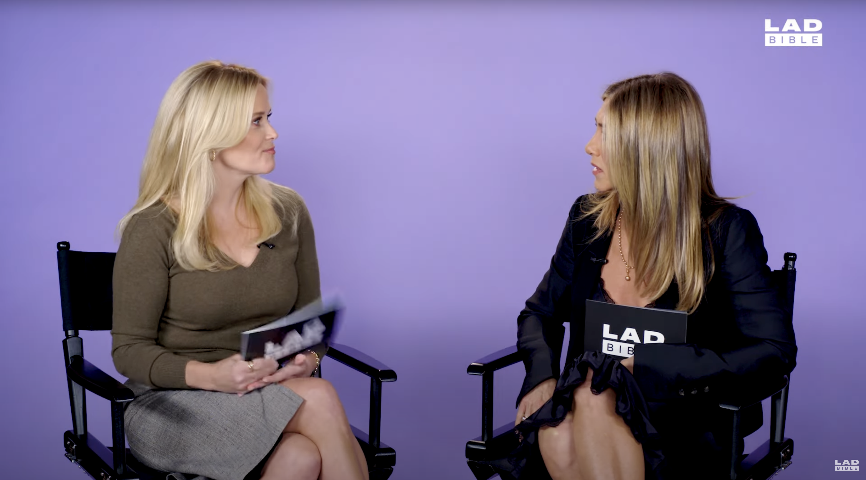 Jennifer Aniston and Reese Witherspoon on chairs. 
