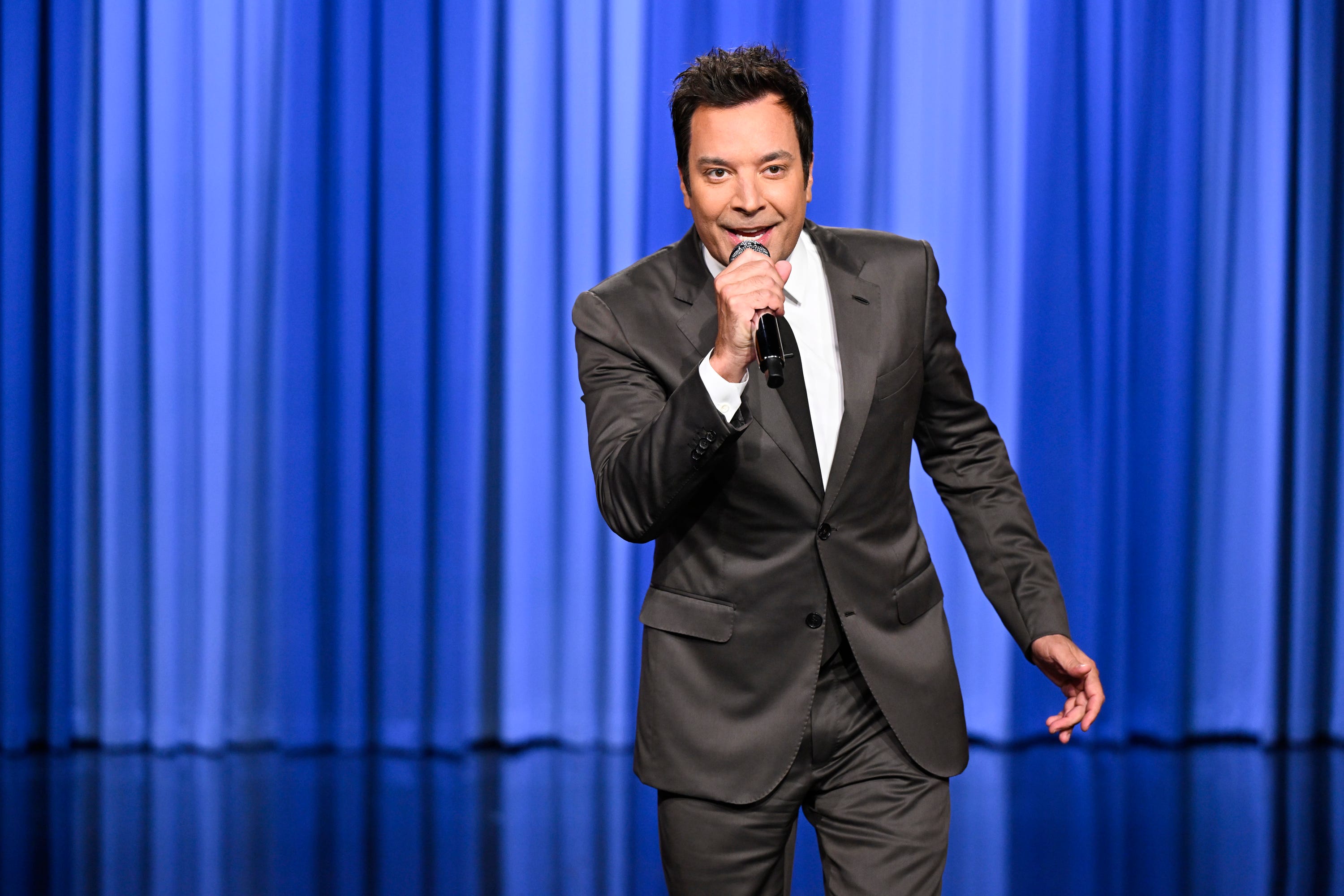 Jimmy Fallon holding a mic