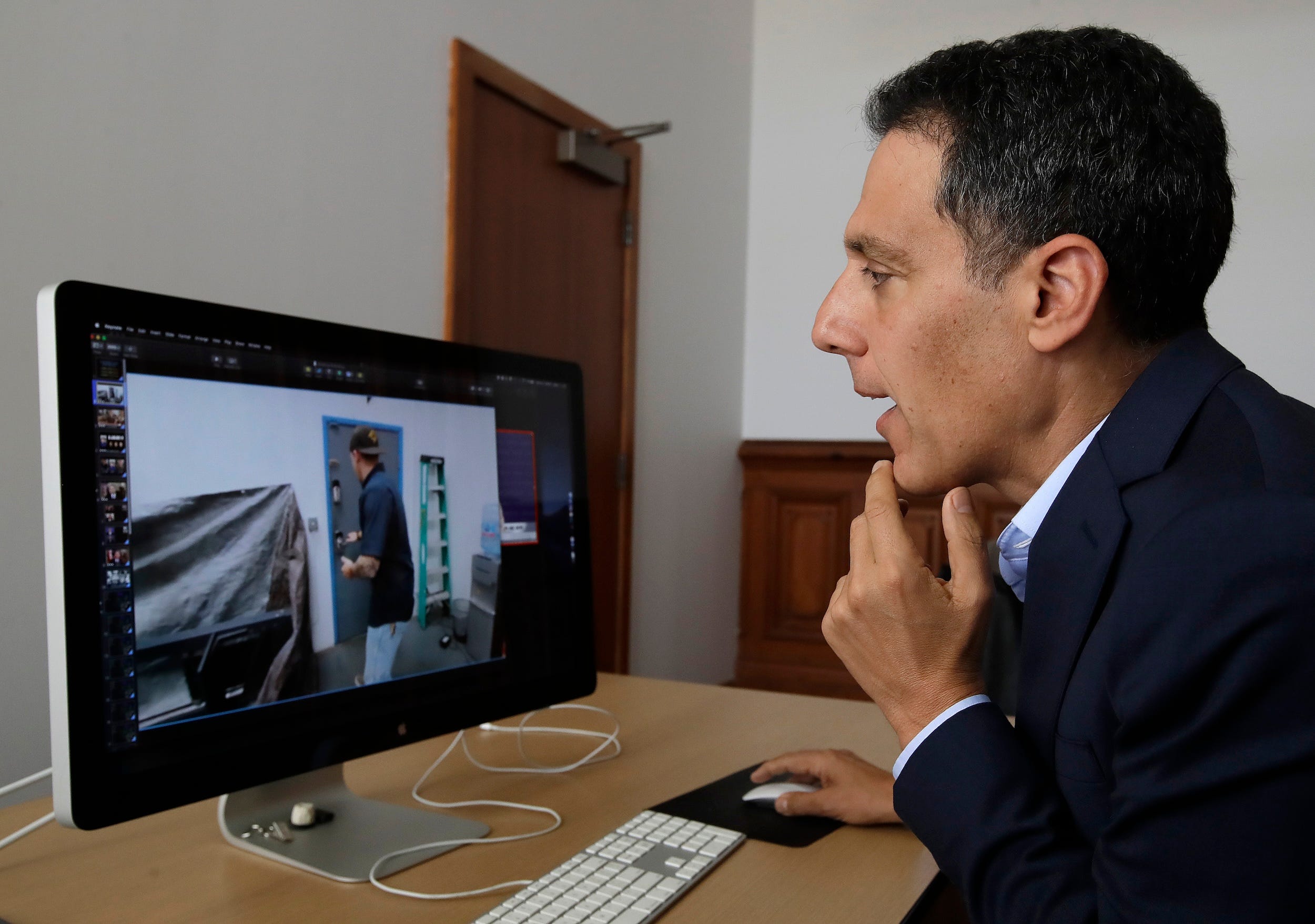 Hany Farid, a professor of a professor at the University of California, studies a computer clip in 2019