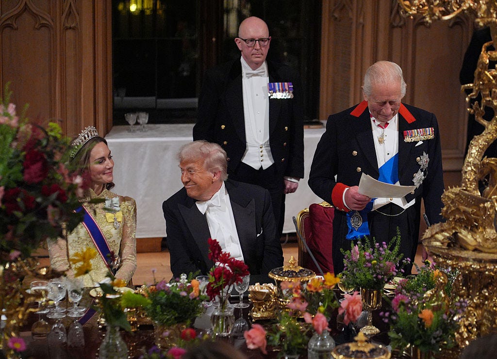 President Donald Trump sits in between Princess Kate and King Charles.