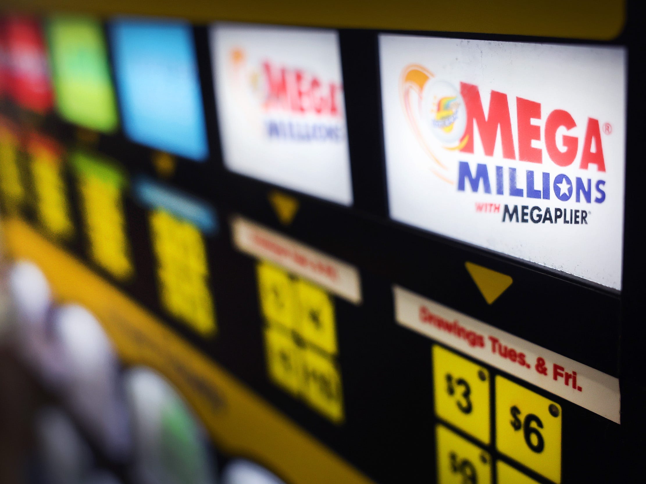 A lottery ticket vending machine offers Mega Millions tickets