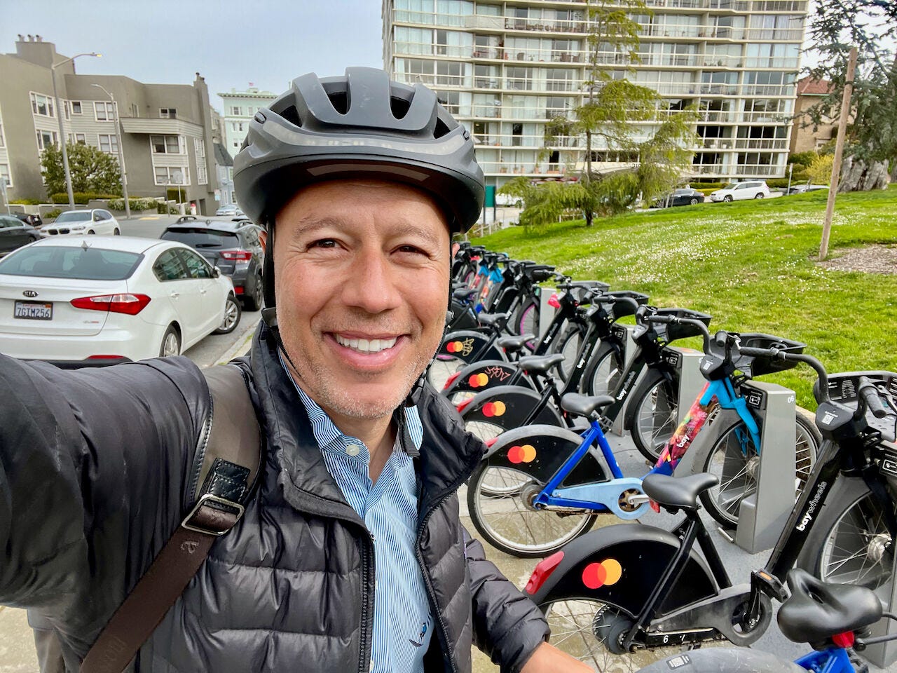 David Risher takes a selfie with Lyft bikes