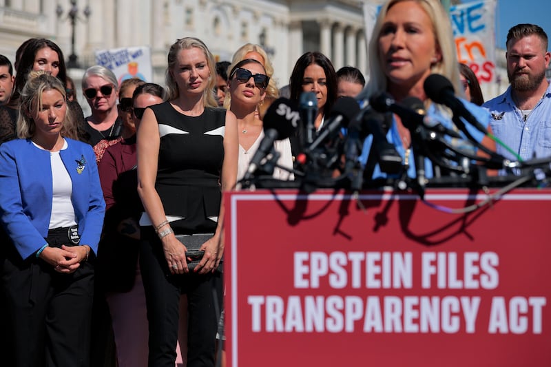 WASHINGTON, DC - SEPTEMBER 03: Some of Jeffrey Epstein's alleged victims, including (L-R) Danielle Bensky, Anouska De Georgiou, Marina Lacerda and others, listen to Rep. Marjorie Taylor Greene (R-GA) speak during a news conference with other survivors outside the U.S. Capitol on September 03, 2025 in Washington, DC. Rep. Thomas Massie (R-KY) and Rep. Ro Khanna (D-CA) have introduced the Epstein List Transparency Act to force the federal government to release all unclassified records from the cases of disgraced financier and sex trafficker Epstein and his associate, Ghislaine Maxwell. (Photo by Chip Somodevilla/Getty Images)