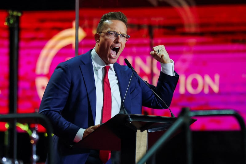 Benny Johnson speaks during a memorial service for slain conservative commentator Charlie Kirk at State Farm Stadium, in Glendale, Arizona, U.S., September 21, 2025.  REUTERS/Daniel Cole