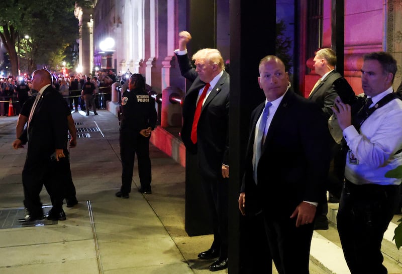 President Donald Trump gestures as he leaves from the Joe's Seafood restaurant near the White House after dinner, in Washington, D.C., U.S., September 9, 2025.