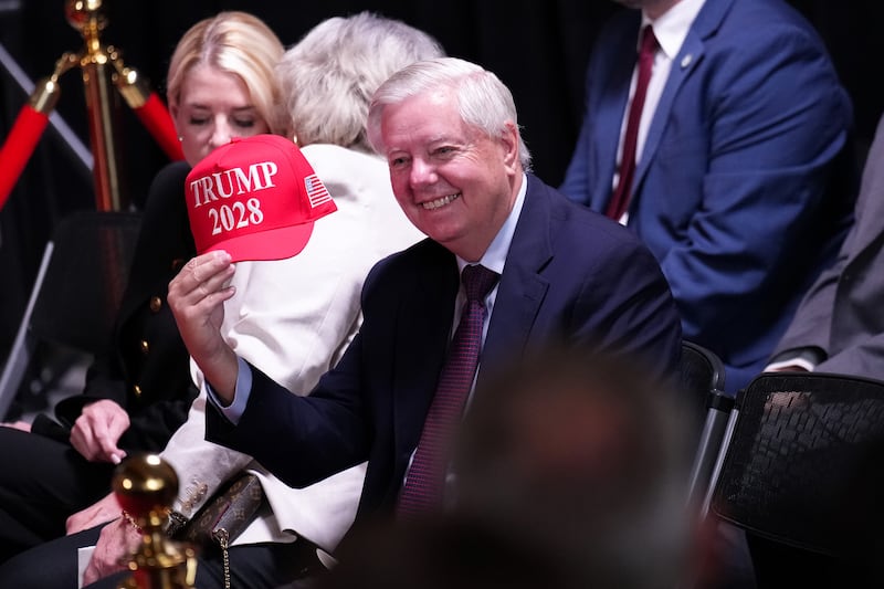 WASHINGTON, DC - AUGUST 13: U.S. Sen. Lindsey Graham (R-SC) holds up a hat that reads "Trump 2028" during an event at the Kennedy Center on August 13, 2025 in Washington, DC. U.S. President Donald Trump announced the first nominees of the annual Kennedy Center Honors since taking control of the center’s board earlier this year. (Photo by Kevin Dietsch/Getty Images)