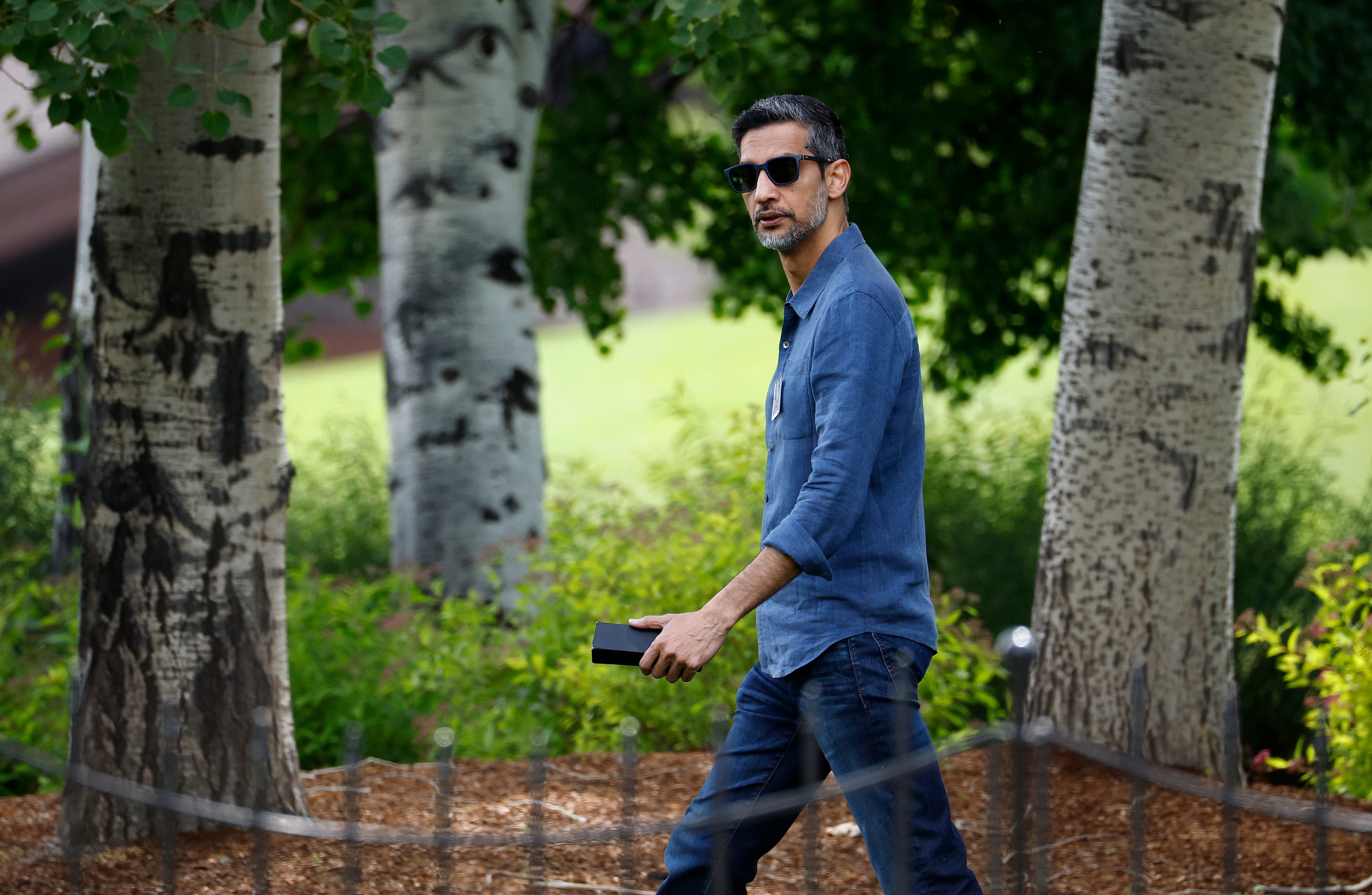 Google CEO Sundar Pichai, walking at the Sun Valley conference, July 2025