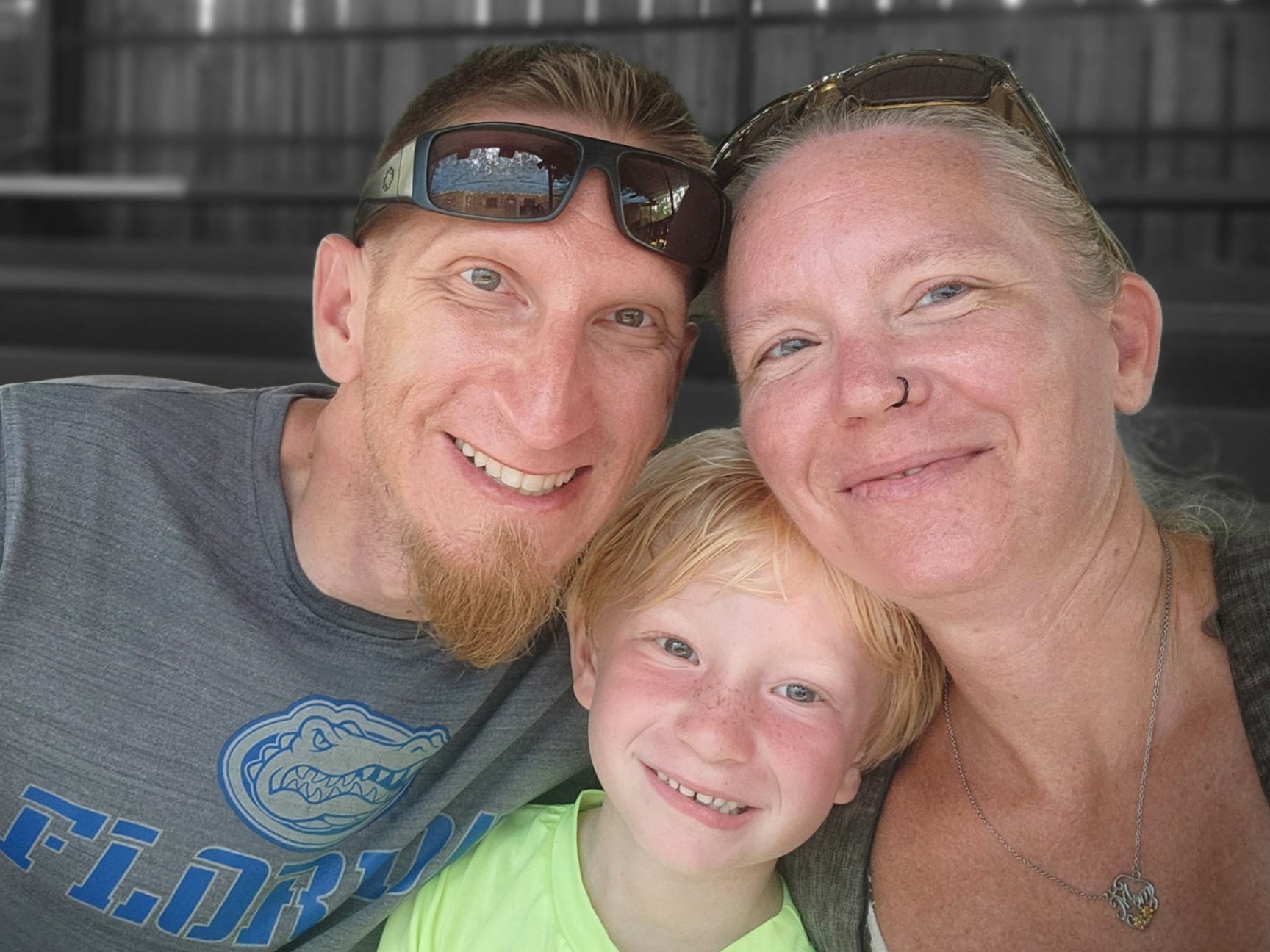 Mother, father and son smiling for selfie