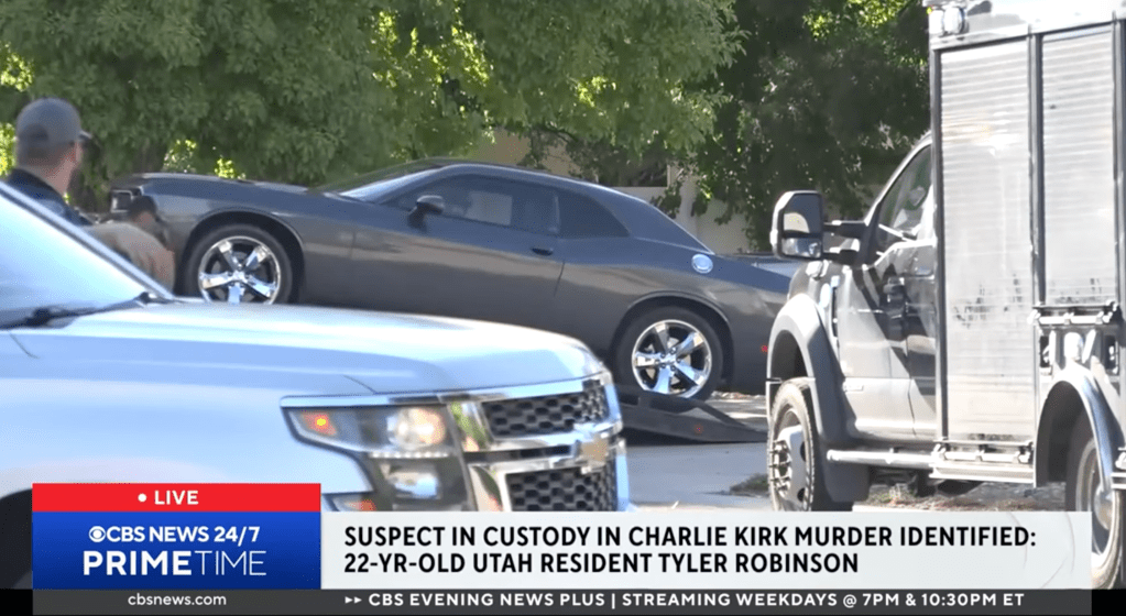 A Dodge Challenger is placed on the bed of a tow truck outside the Tyler Robinson's family home in Washington, Utah on Sept.12, 2025.