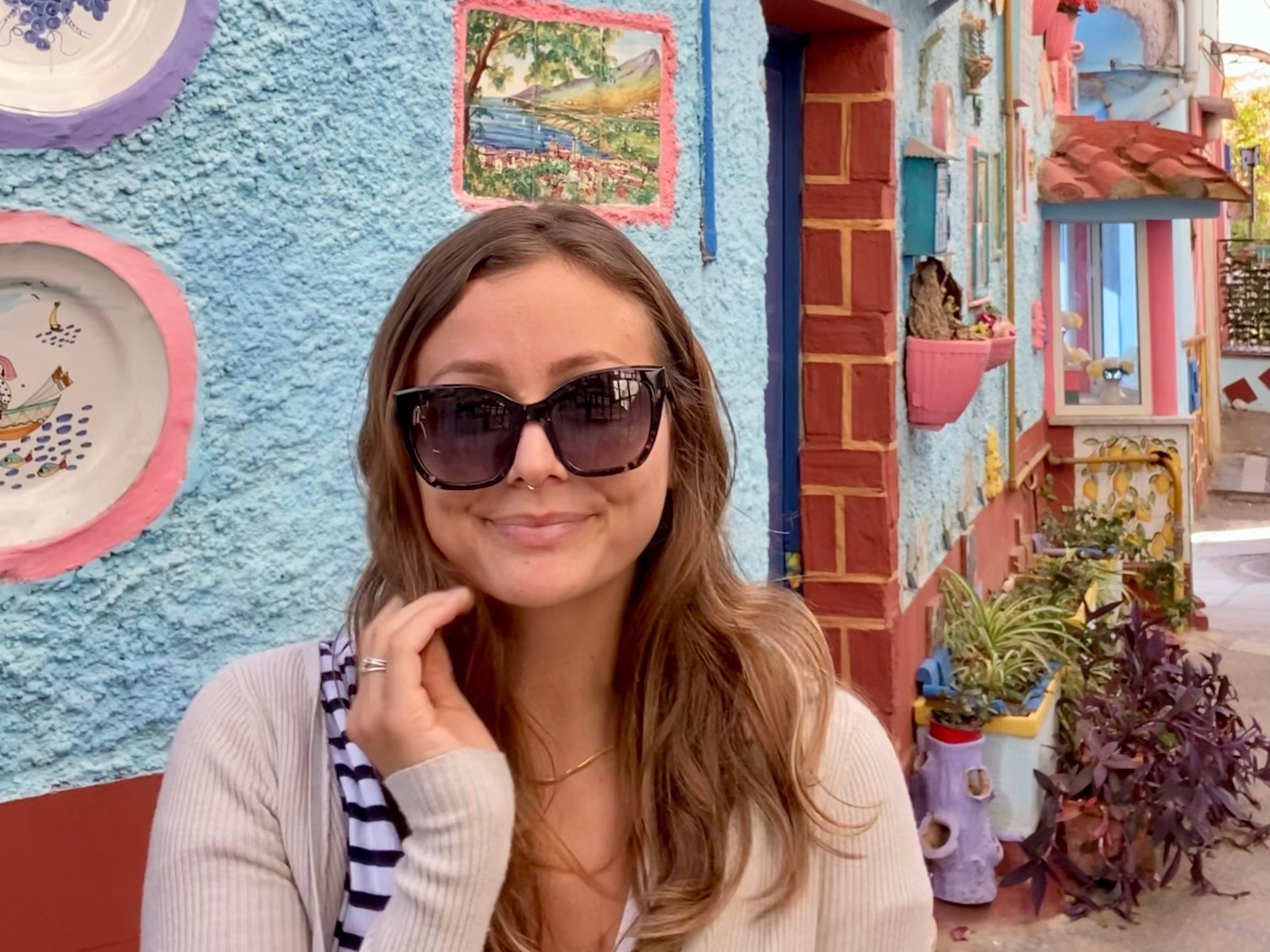 Author Melanie Gordon smiling at Case Colorate in Vietri Sul Mare