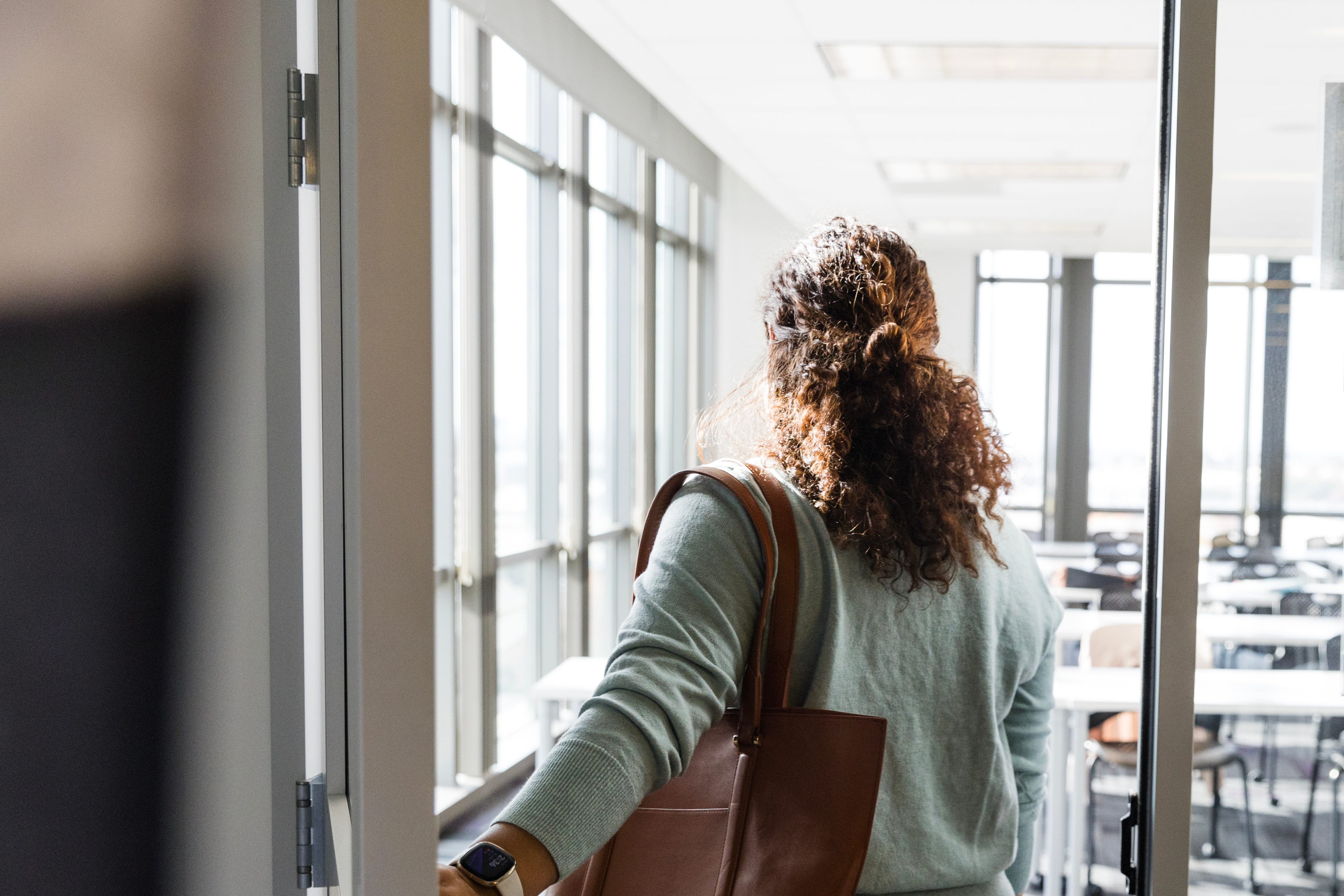 The professor walks to her classroom