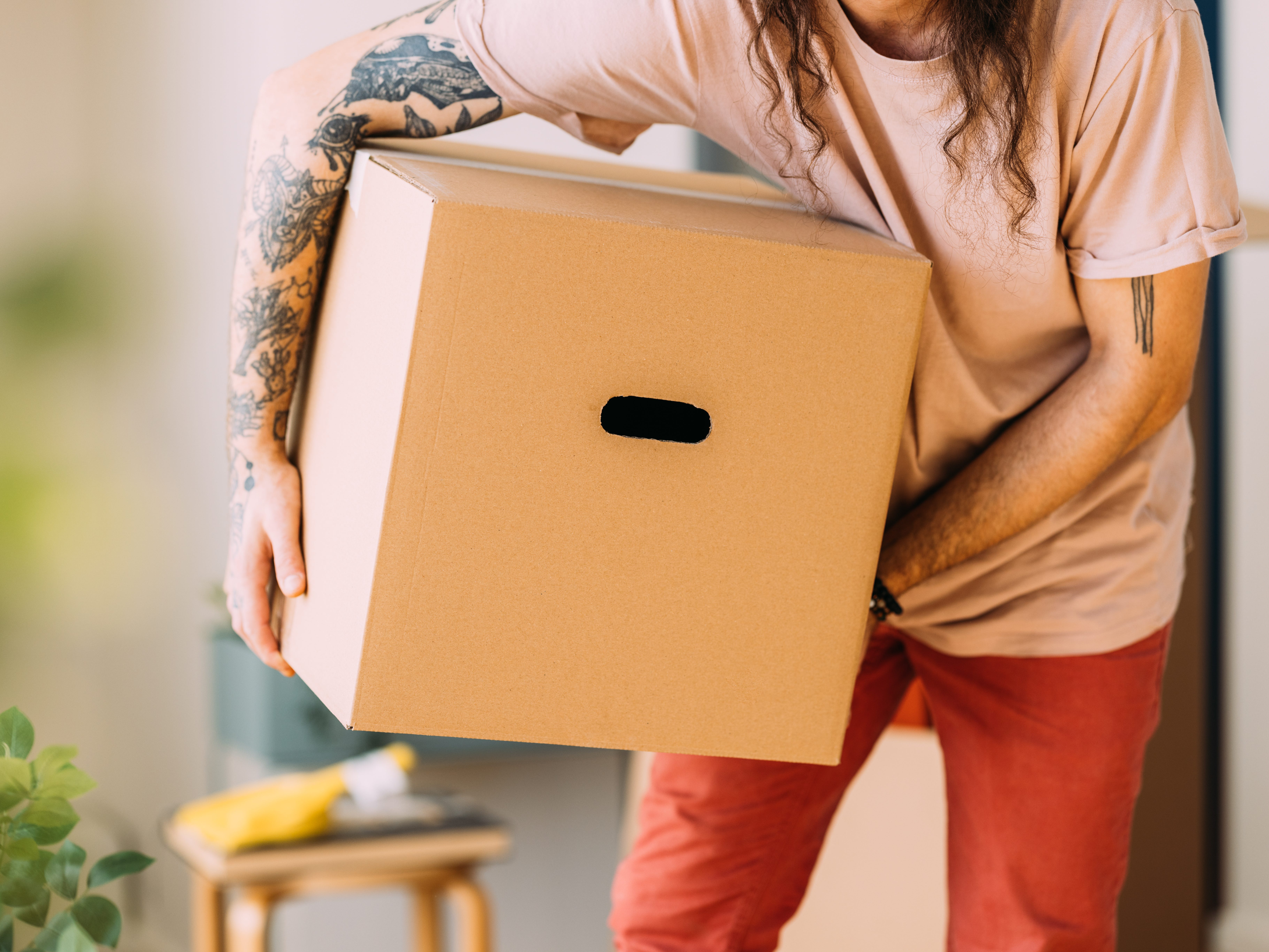 a man holding a moving box