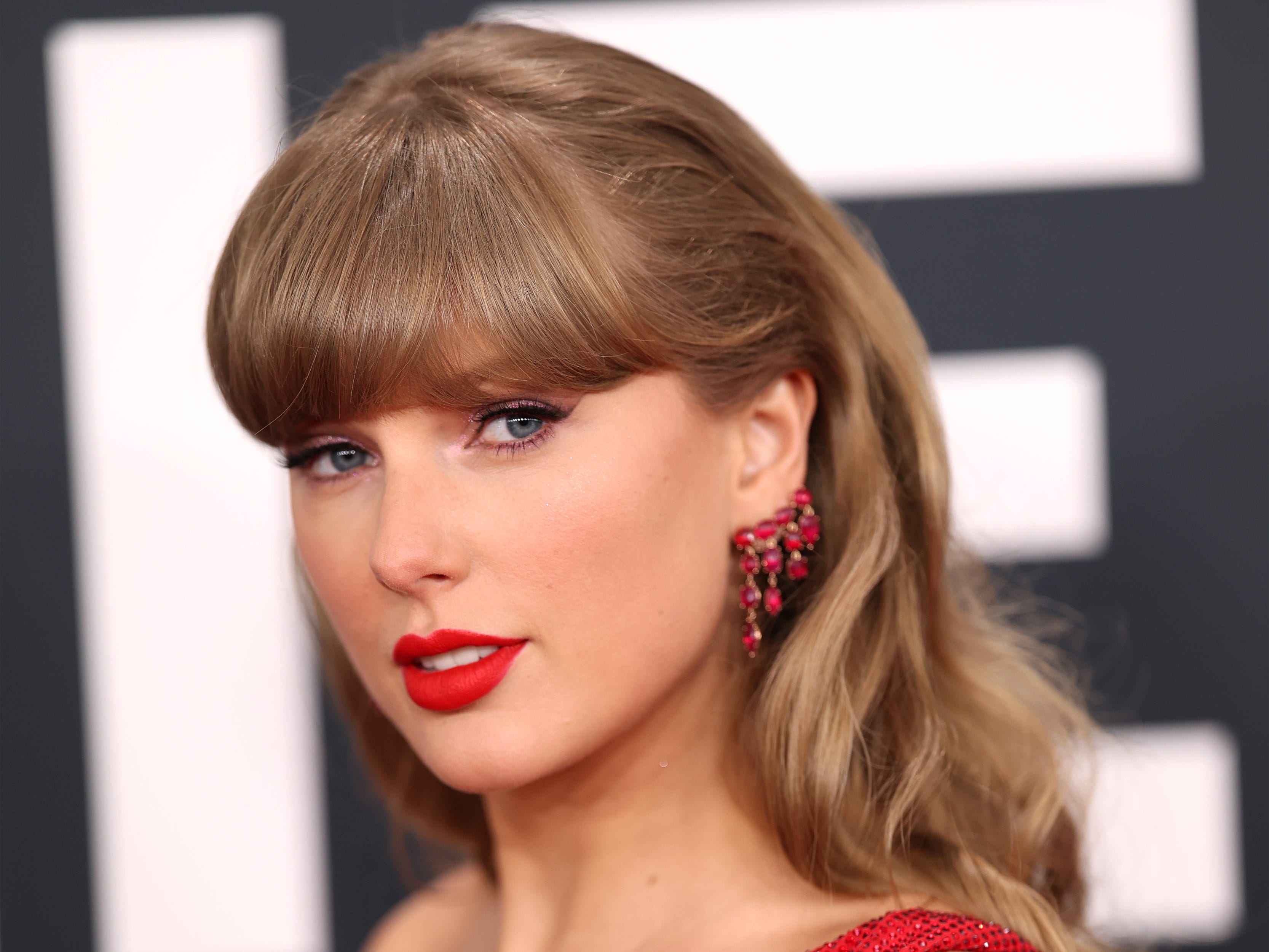 Taylor Swift in a red dress at the 67th Grammy Awards in Los Angeles.