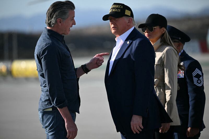 Donald Trump and First Lady Melania Trump are greeted by California Governor Gavin Newsom upon arrival at Los Angeles International Airport in Los Angeles, California, on January 24, 2025.